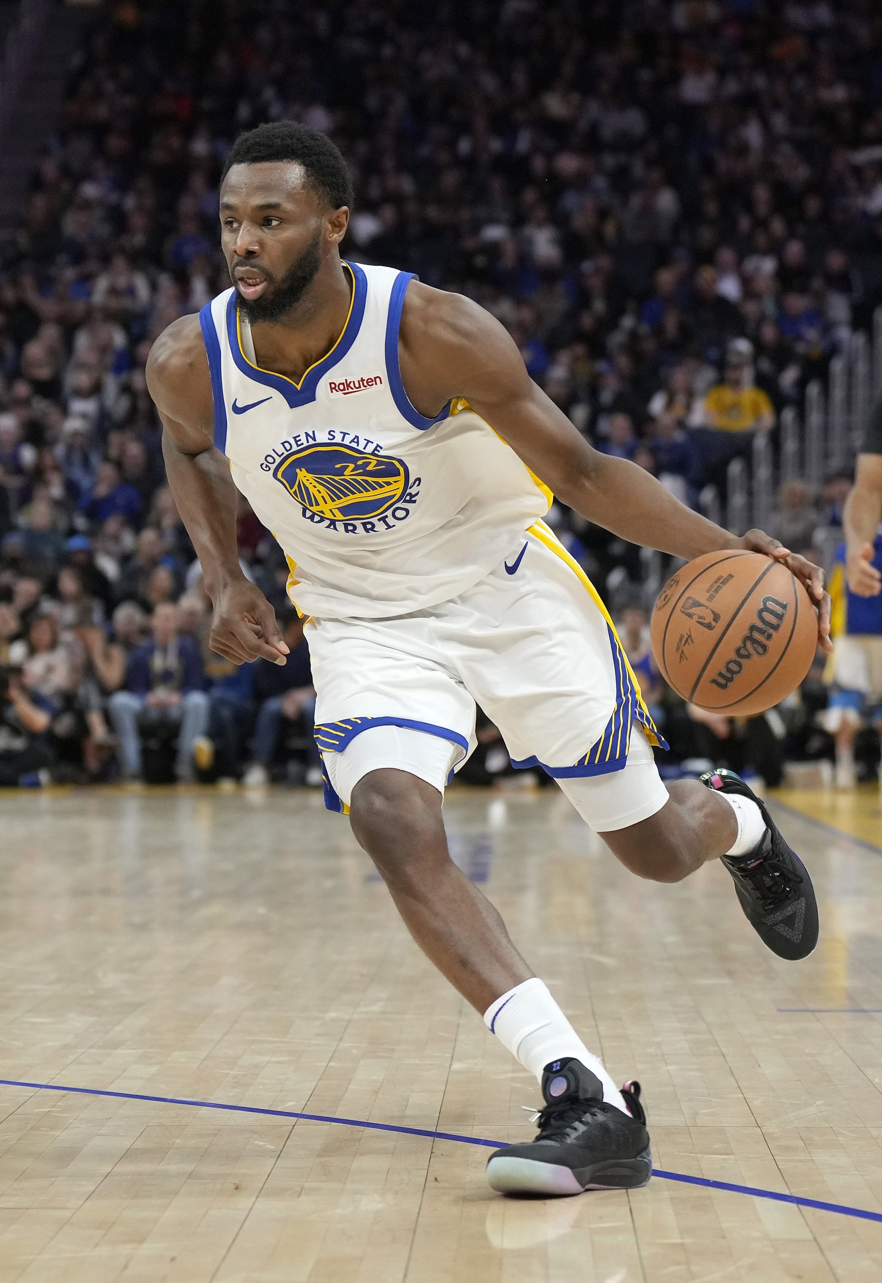 SAN FRANCISCO, CALIFORNIA - JANUARY 02: Andrew Wiggins #22 of the Golden State Warriors dribbling the ball looks to drive towards the basket against the Orlando Magic during the fourth quarter of an NBA basketball game at Chase Center on January 02, 2024 in San Francisco, California. NOTE TO USER: User expressly acknowledges and agrees that, by downloading and or using this photograph, User is consenting to the terms and conditions of the Getty Images License Agreement. (Photo by Thearon W. Henderson/Getty Images)