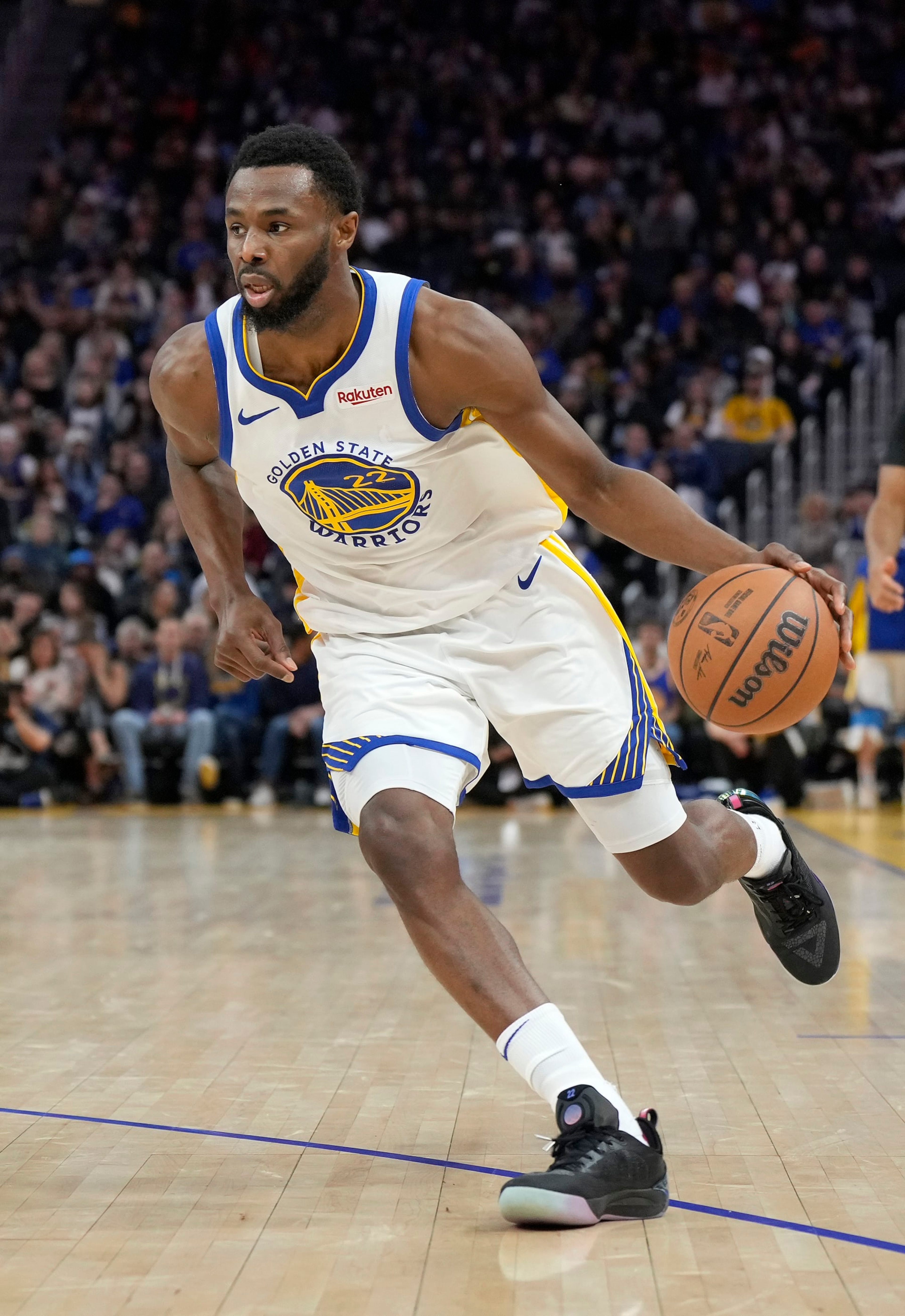 SAN FRANCISCO, CALIFORNIA - JANUARY 02: Andrew Wiggins #22 of the Golden State Warriors dribbling the ball looks to drive towards the basket against the Orlando Magic during the fourth quarter of an NBA basketball game at Chase Center on January 02, 2024 in San Francisco, California. NOTE TO USER: User expressly acknowledges and agrees that, by downloading and or using this photograph, User is consenting to the terms and conditions of the Getty Images License Agreement. (Photo by Thearon W. Henderson/Getty Images)