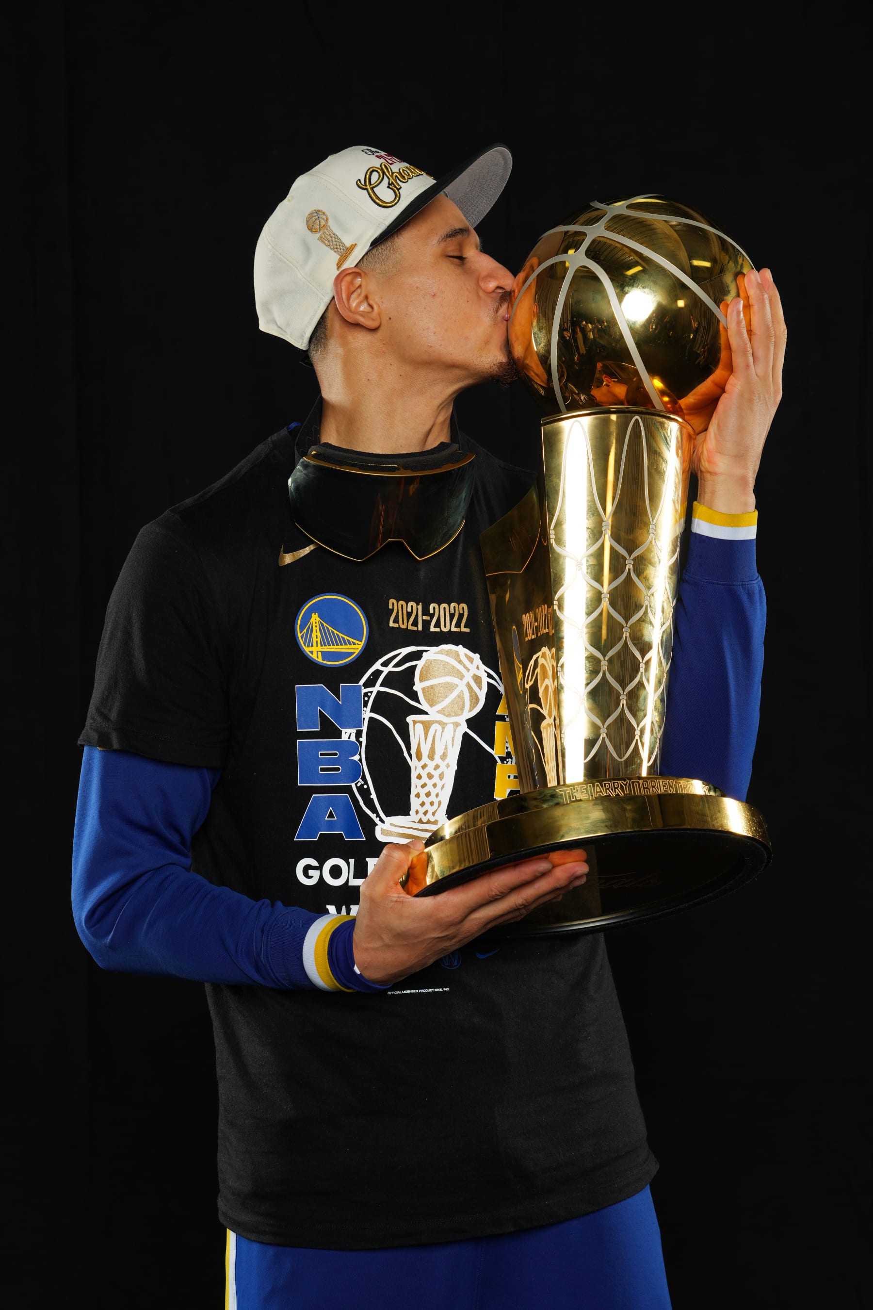 BOSTON, MA - JUNE 16: Juan Toscano-Anderson #95 of the Golden State Warriors poses for a portrait with the Larry OBrien Trophy after winning Game Six of the 2022 NBA Finals against the Boston Celtics on June 16, 2022 at TD Garden in Boston, Massachusetts. NOTE TO USER: User expressly acknowledges and agrees that, by downloading and or using this photograph, user is consenting to the terms and conditions of Getty Images License Agreement. Mandatory Copyright Notice: Copyright 2022 NBAE (Photo by Jesse D. Garrabrant/NBAE via Getty Images)