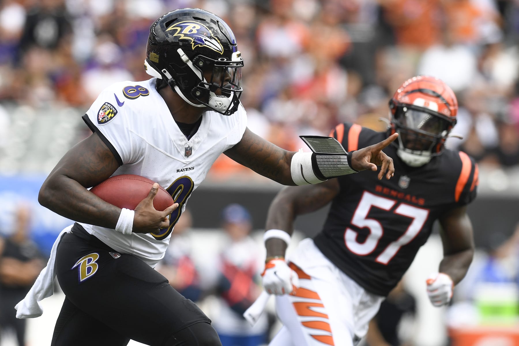 CINCINNATI, OH - SEPTEMBER 17: Baltimore Ravens Quarterback Lamar Jackson (8) scrambles as Cincinnati Bengals Linebacker Germaine Pratt (57) defends during an NFL game between the Baltimore Ravens and the Cincinnati Bengals on September 17, 2023, at Paycor Stadium in Cincinnati, Ohio. (Photo by Michael Allio/Icon Sportswire via Getty Images)