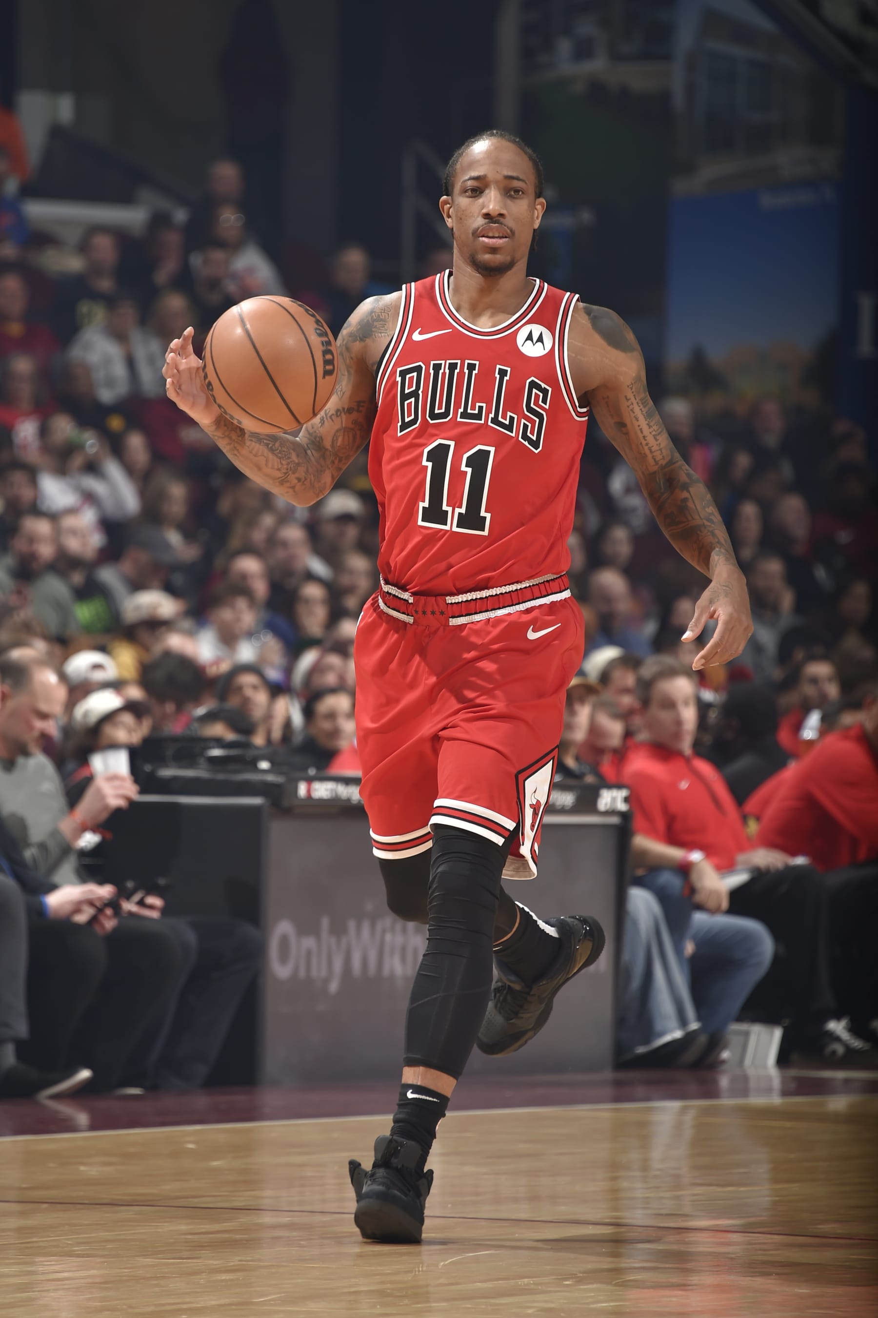 CLEVELAND, OH - JANUARY 15: DeMar DeRozan #11 of the Chicago Bulls dribbles the ball during the game against the Cleveland Cavaliers on January 15, 2024 at Rocket Mortgage FieldHouse in Cleveland, Ohio. NOTE TO USER: User expressly acknowledges and agrees that, by downloading and/or using this Photograph, user is consenting to the terms and conditions of the Getty Images License Agreement. Mandatory Copyright Notice: Copyright 2024 NBAE (Photo by David Liam Kyle/NBAE via Getty Images)