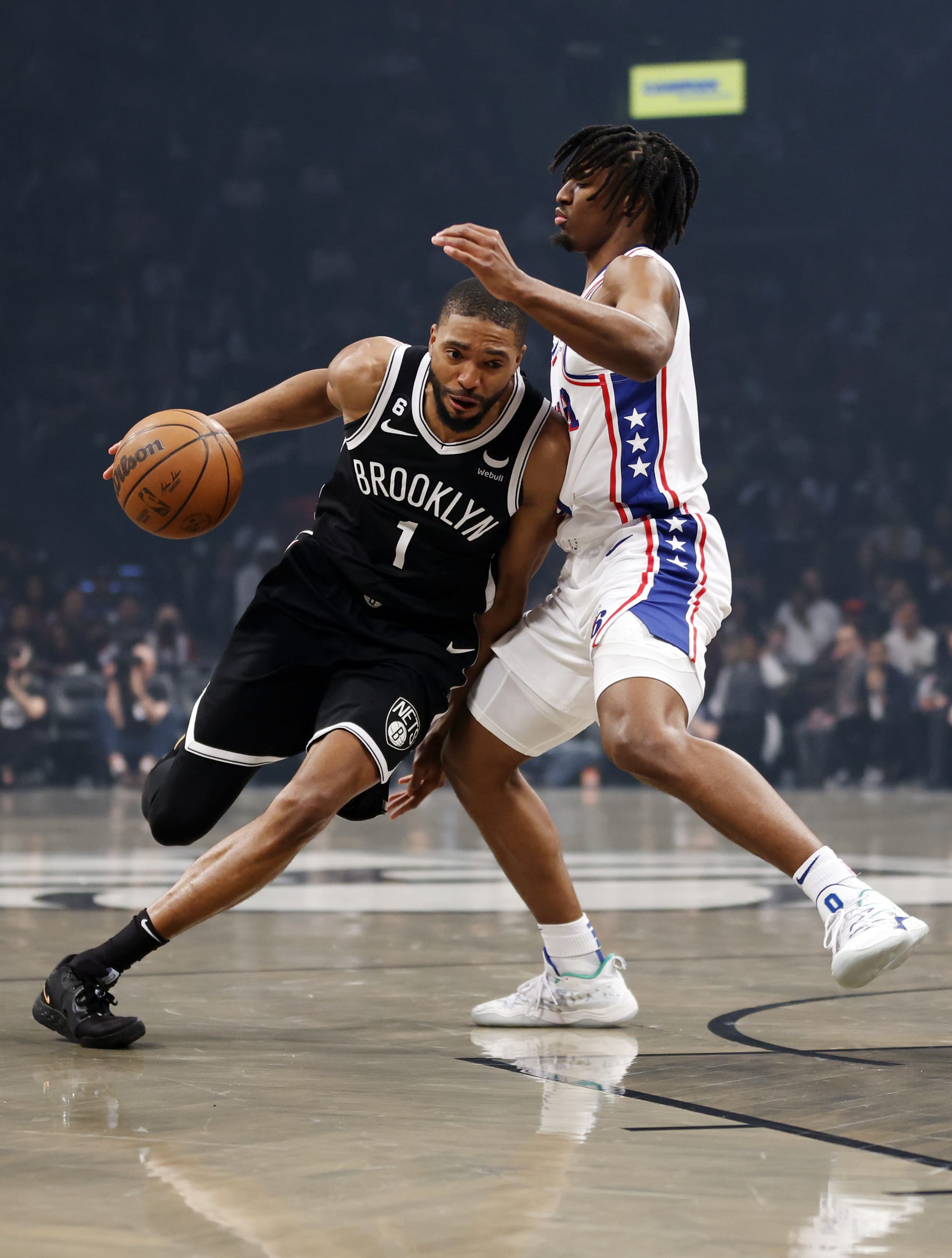 NEW YORK, NEW YORK - APRIL 22: Mikal Bridges #1 of the Brooklyn Nets dribbles against Tyrese Maxey #0 of the Philadelphia 76ers during the first half of Game Four of the Eastern Conference First Round Playoffs at Barclays Center on April 22, 2023 in the Brooklyn borough of New York City. NOTE TO USER: User expressly acknowledges and agrees that, by downloading and or using this photograph, User is consenting to the terms and conditions of the Getty Images License Agreement. (Photo by Sarah Stier/Getty Images)