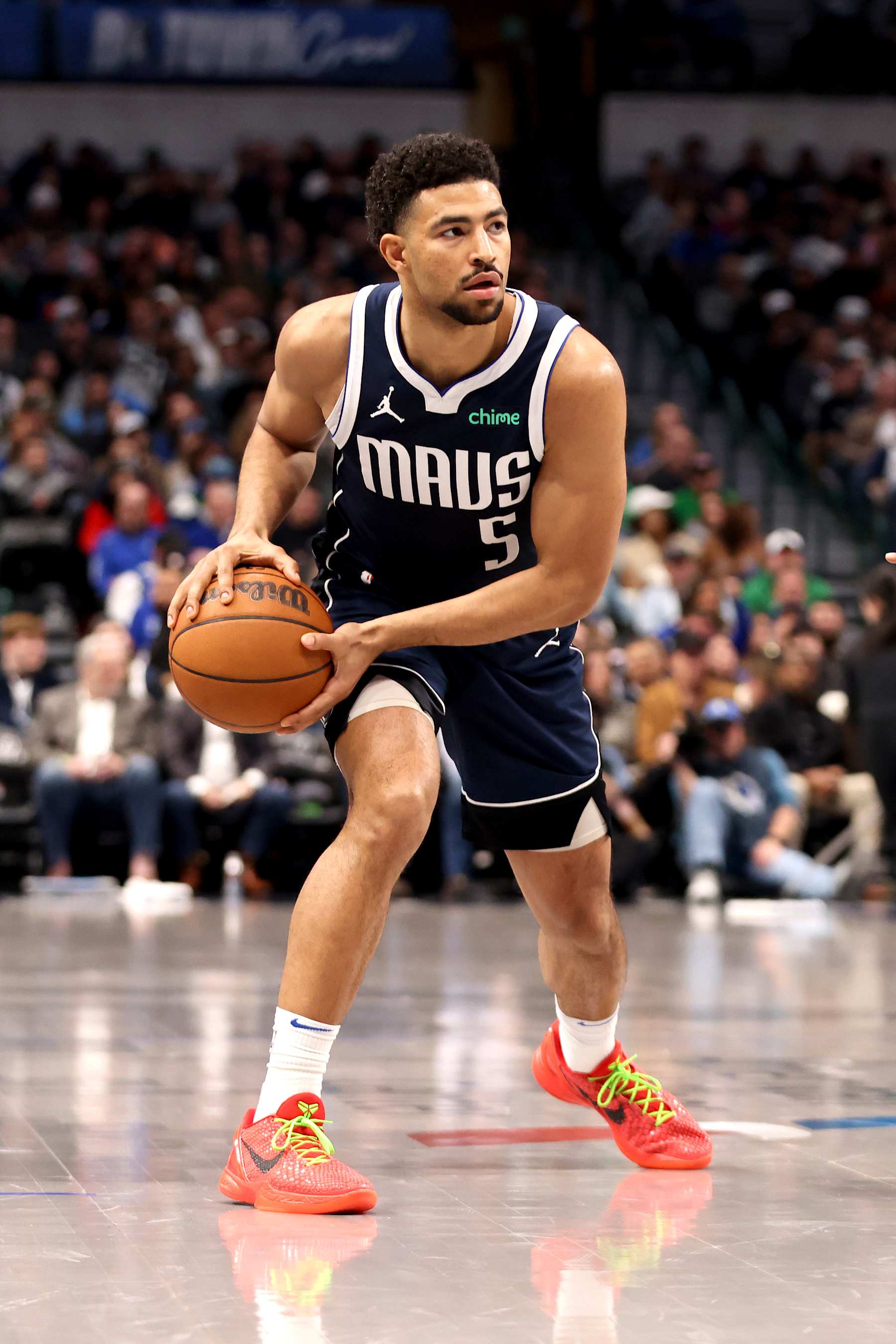 DALLAS, TEXAS - JANUARY 27: Quentin Grimes #5 of the Dallas Mavericks looks to pass the ball against the Washington Wizards during the second half at American Airlines Center on January 27, 2025 in Dallas, Texas. NOTE TO USER: User expressly acknowledges and agrees that, by downloading and or using this photograph, User is consenting to the terms and conditions of the Getty Images License Agreement. (Photo by Tim Heitman/Getty Images)