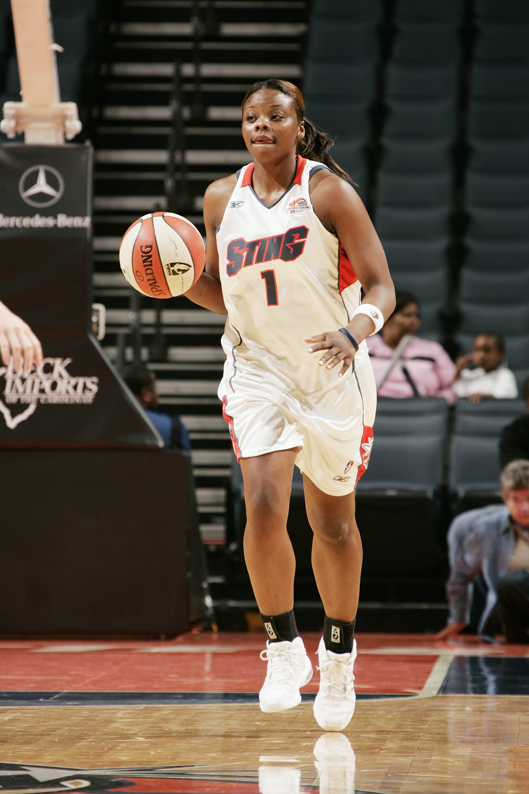CHARLOTTE, NC - MAY 9:  Tasha Butts #1 of the Charlotte Sting moves the ball against the San Antonio Silver Stars on May 9, 2006 at the Charlotte Bobcats Arena in Charlotte, North Carolina. NOTE TO USER: User expressly acknowledges and agrees that, by downloading and or using this photograph, User is consenting to the terms and conditions of the Getty Images License Agreement. Mandatory Copyright Notice: Copyright 2006 NBAE (Photo by Kent Smith/NBAE via Getty Images)