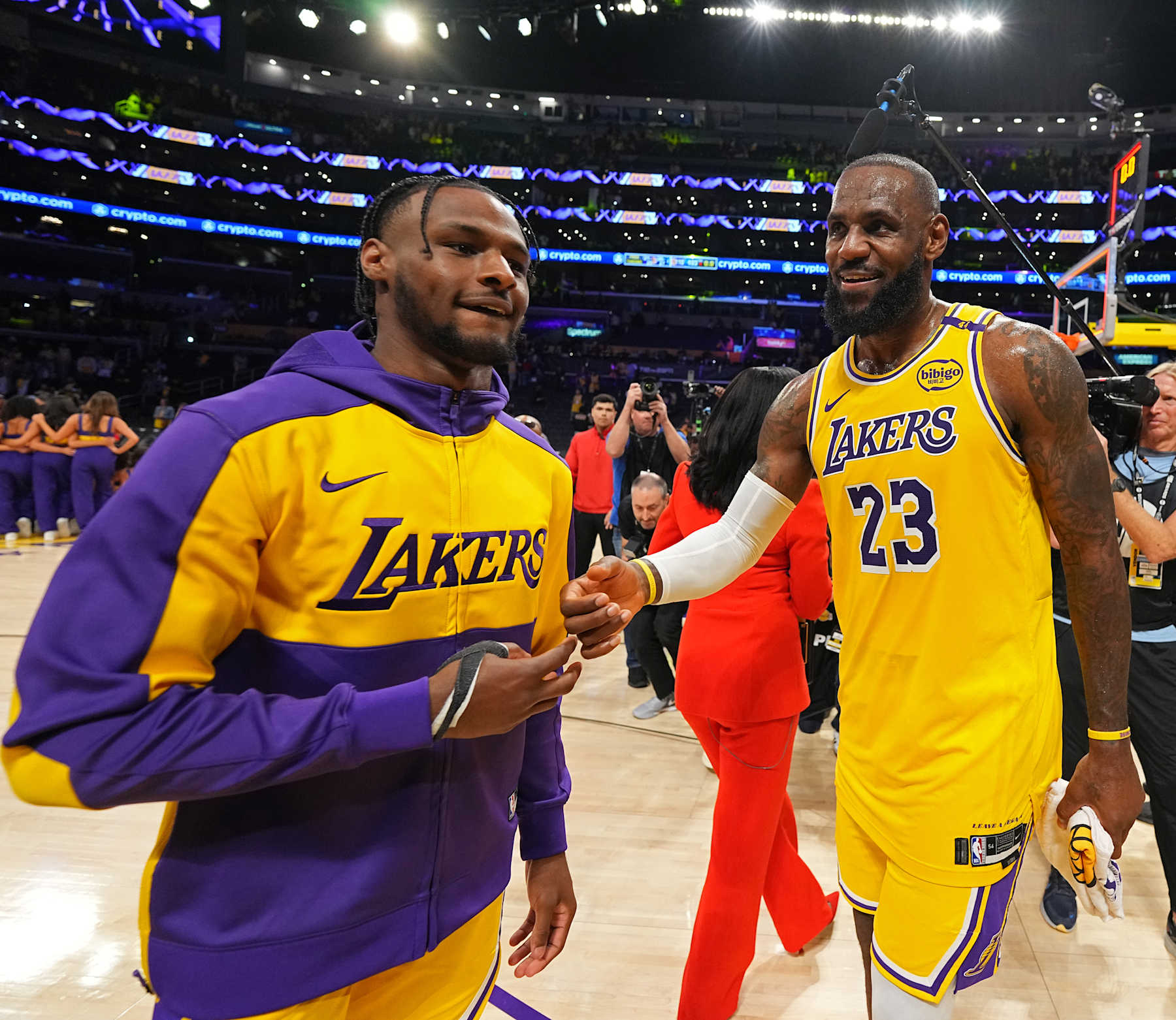 LOS ANGELES, CA - OCTOBER 22: Bronny James #9 and LeBron James #23 of the Los Angeles Lakers high five after the game against the Minnesota Timberwolves on October 22, 2024 at Crypto.Com Arena in Los Angeles, California. NOTE TO USER: User expressly acknowledges and agrees that, by downloading and/or using this Photograph, user is consenting to the terms and conditions of the Getty Images License Agreement. Mandatory Copyright Notice: Copyright 2024 NBAE (Photo by Garrett Ellwood/NBAE via Getty Images)
