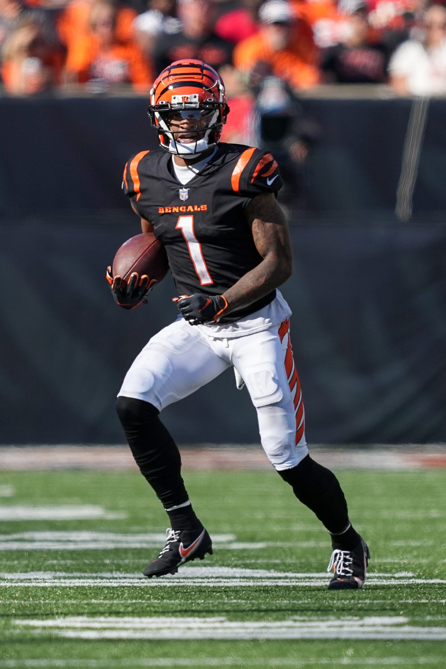 CINCINNATI, OHIO - OCTOBER 23: Ja'Marr Chase #1 of the Cincinnati Bengals runs with the ball in the third quarter against the Atlanta Falcons at Paycor Stadium on October 23, 2022 in Cincinnati, Ohio. (Photo by Dylan Buell/Getty Images)