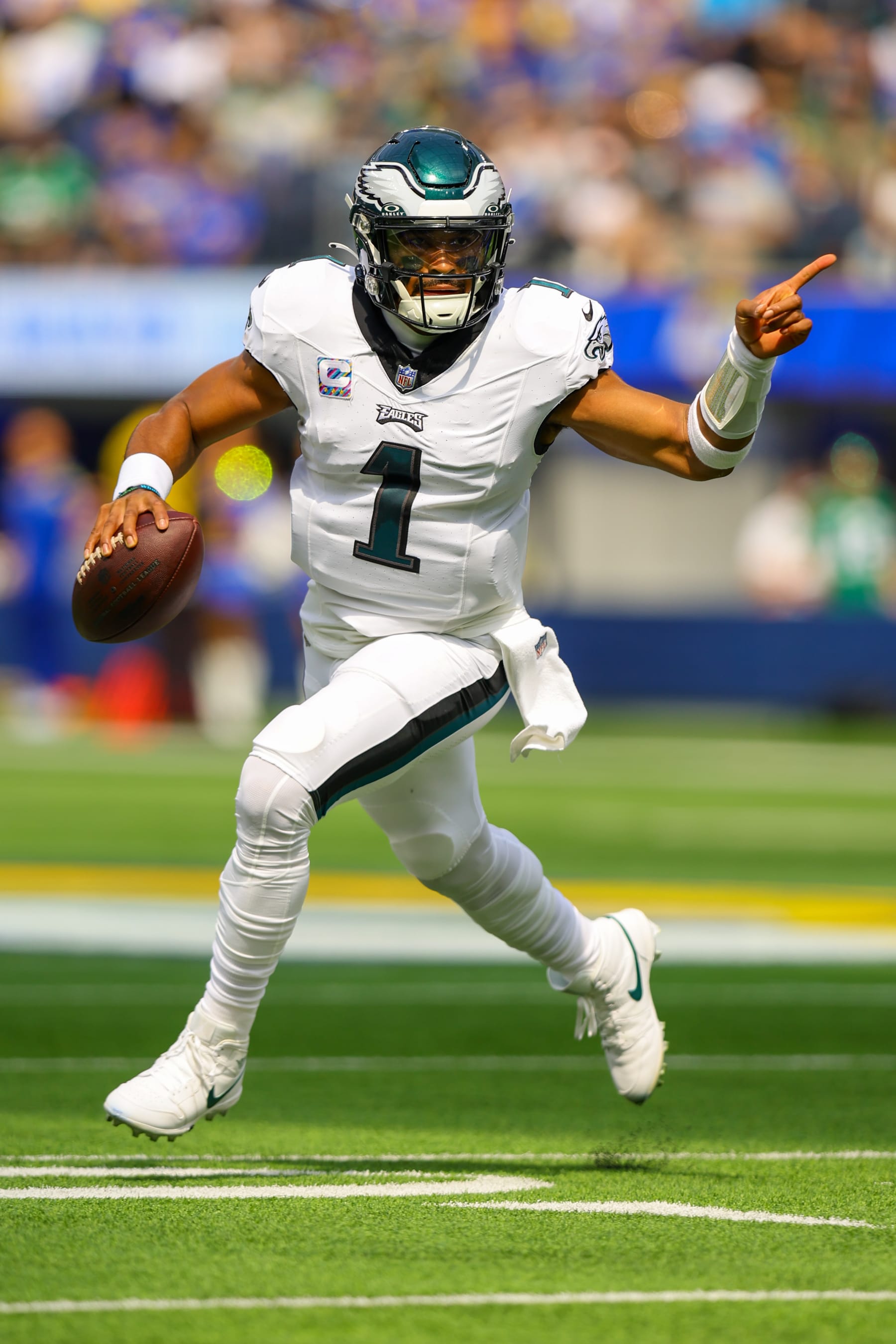 INGLEWOOD, CA - OCTOBER 08: Philadelphia Eagles quarterback Jalen Hurts (1) rolls out of the pocket during the NFL game between the Philadelphia Eagles and the Los Angeles Rams on October 08, 2023, at SoFi Stadium in Inglewood, CA.(Photo by Jordon Kelly/Icon Sportswire via Getty Images)