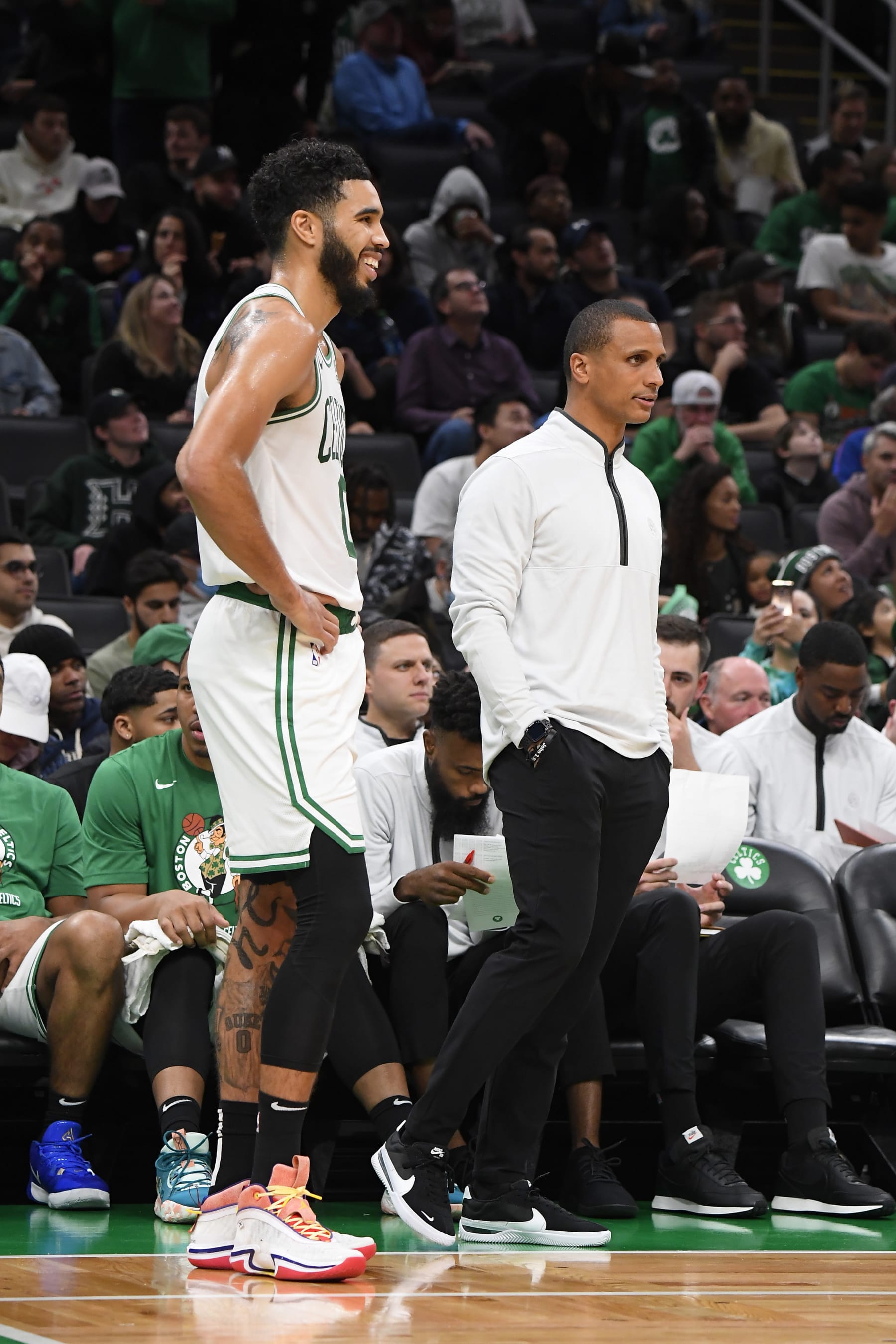 BOSTON, MA - OCTOBER 2:  Jayson Tatum #0 and Head Coach Joe Mazzulla of the Boston Celtics look on during the game against the Charlotte Hornets on October 2, 2022 at the TD Garden in Boston, Massachusetts.  NOTE TO USER: User expressly acknowledges and agrees that, by downloading and or using this photograph, User is consenting to the terms and conditions of the Getty Images License Agreement. Mandatory Copyright Notice: Copyright 2022 NBAE  (Photo by Brian Babineau/NBAE via Getty Images)
