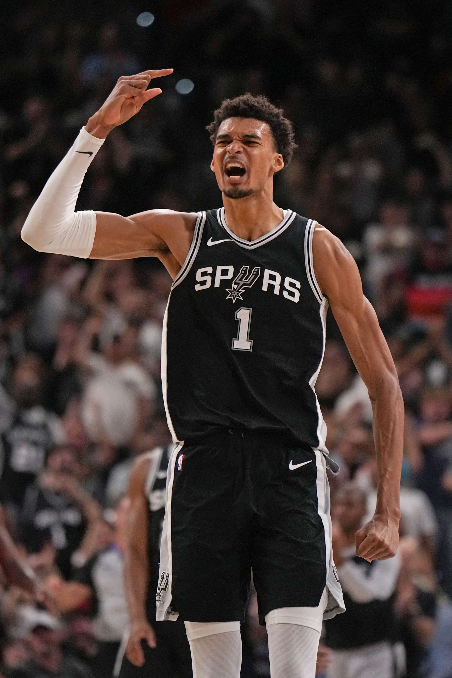 SAN ANTONIO, TX - OCTOBER 28: Victor Wembanyama #1 of the San Antonio Spurs celebrates during the game against the Houston Rockets on October 28, 2024 at the Frost Bank Center in San Antonio, Texas. NOTE TO USER: User expressly acknowledges and agrees that, by downloading and or using this photograph, user is consenting to the terms and conditions of the Getty Images License Agreement. Mandatory Copyright Notice: Copyright 2024 NBAE (Photos by Jesse D. Garrabrant/NBAE via Getty Images)