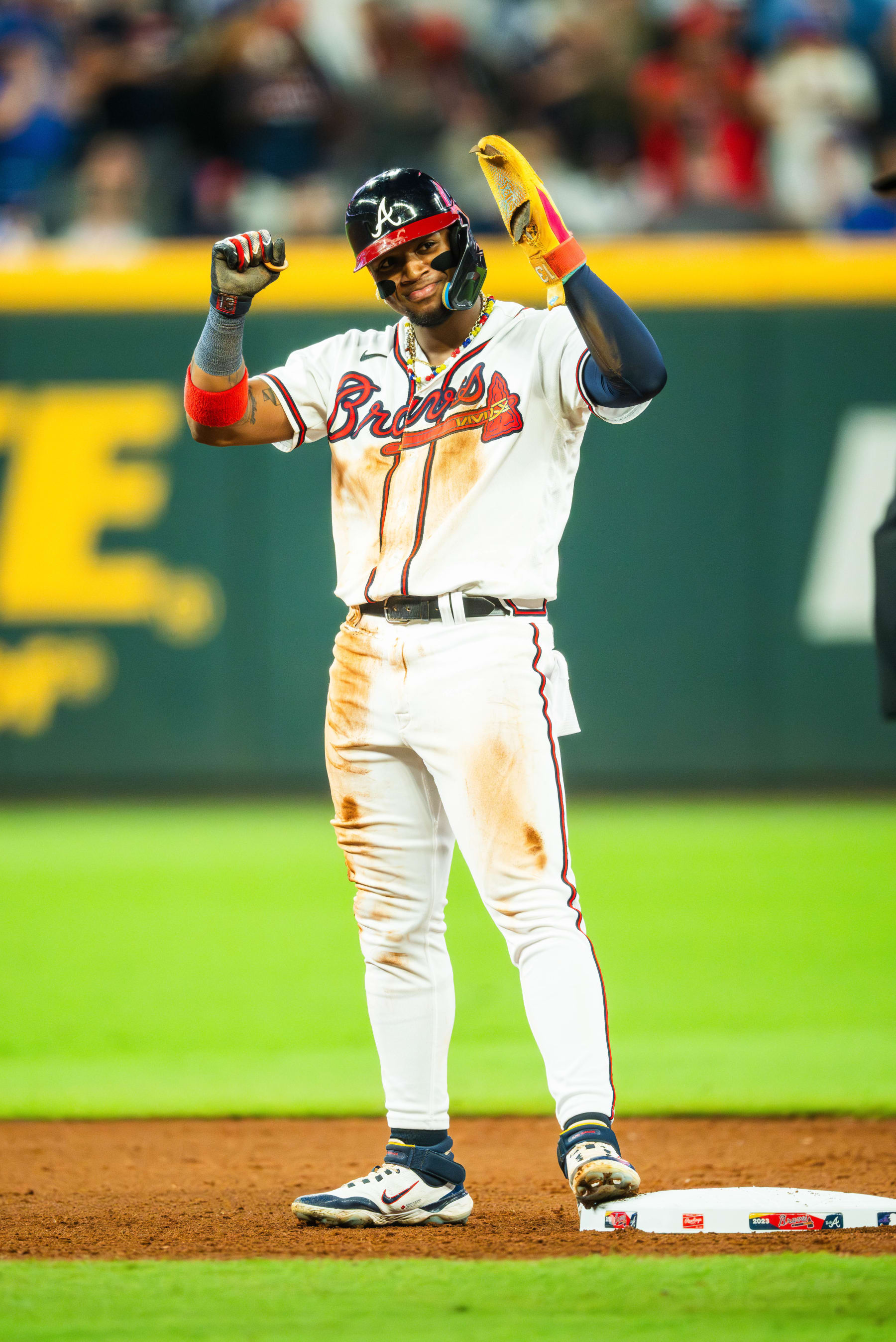 ATLANTA, GA - SEPTEMBER 27: Ronald Acuna Jr. #13 of the Atlanta Braves celebrates after recording his 70th steal of the season during the tenth inning against the Chicago Cubs at Truist Park on September 27, 2023 in Atlanta, Georgia. (Photo by Kevin D. Liles/Atlanta Braves/Getty Images)