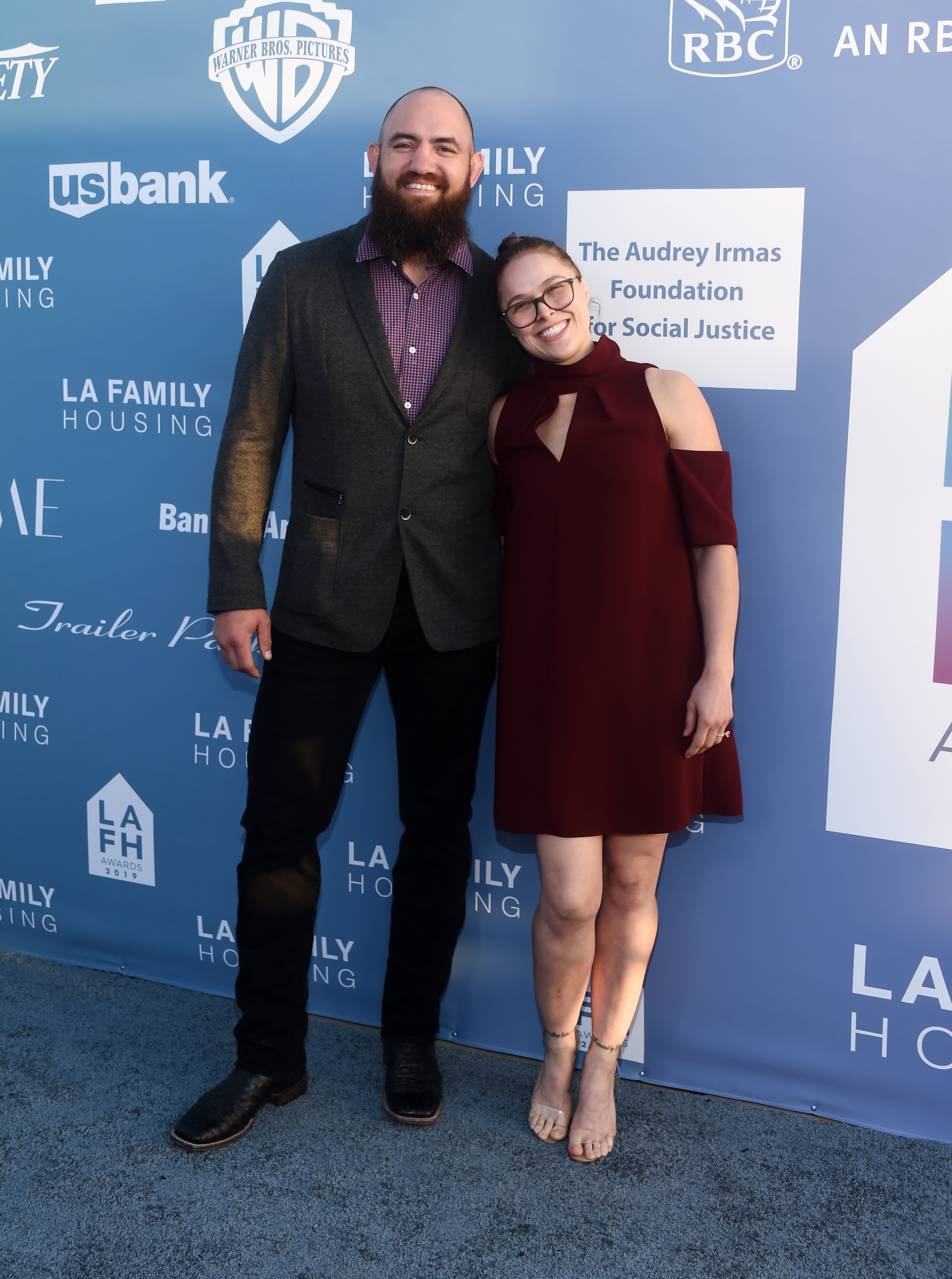 WEST HOLLYWOOD, CALIFORNIA - APRIL 25: Travis Browne (L) and Ronda Rousey arrive at the LA Family Housing Annual LAFH Awards and Fundraiser Celebration at The Lot on April 25, 2019 in West Hollywood, California. (Photo by Amanda Edwards/WireImage)