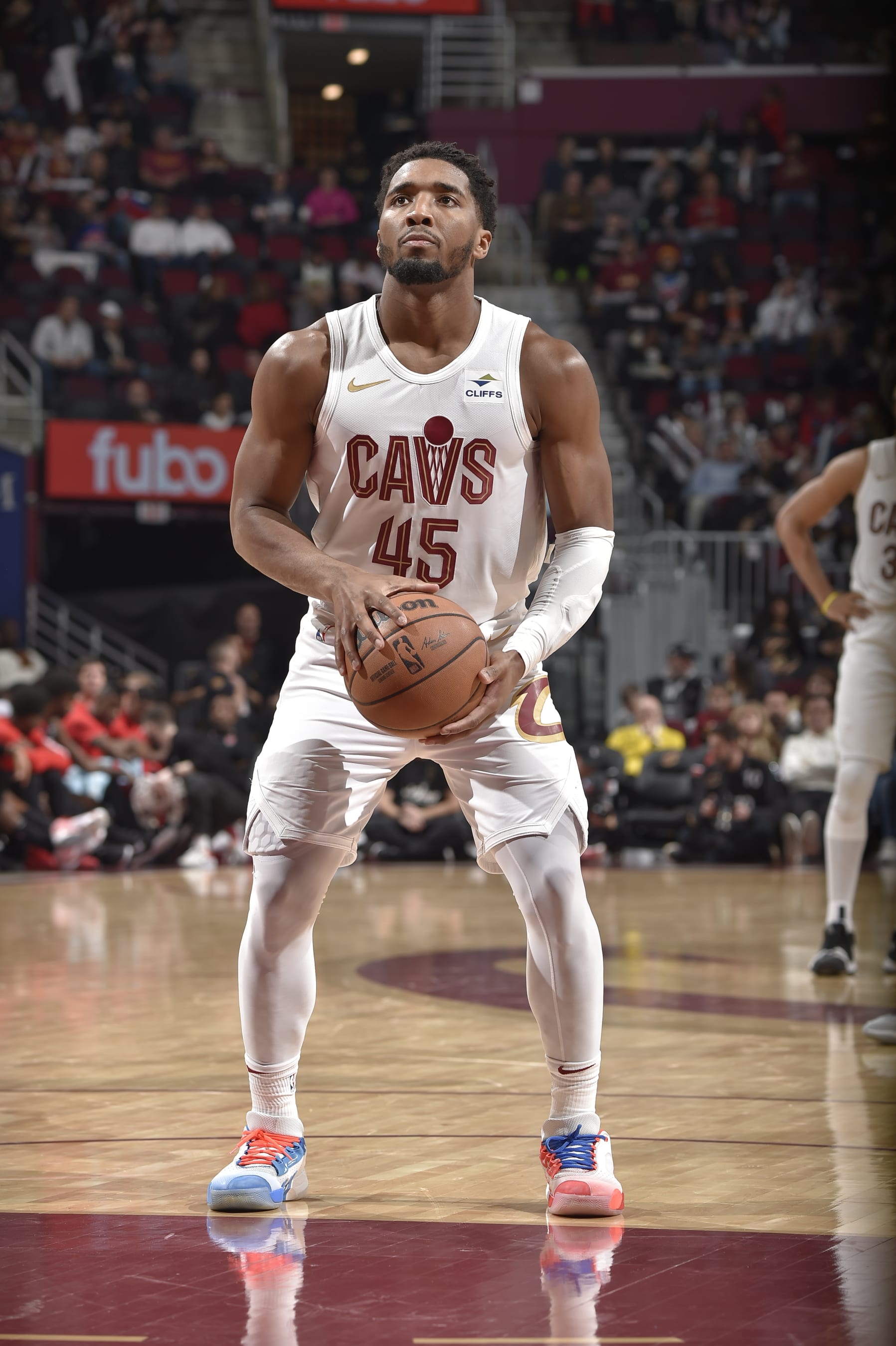 CLEVELAND, OH - DECEMBER 18: Donovan Mitchell #45 of the Cleveland Cavaliers shoots a free throw during the game against the Houston Rockets on December 18, 2023 at Rocket Mortgage FieldHouse in Cleveland, Ohio. NOTE TO USER: User expressly acknowledges and agrees that, by downloading and/or using this Photograph, user is consenting to the terms and conditions of the Getty Images License Agreement. Mandatory Copyright Notice: Copyright 2023 NBAE (Photo by David Liam Kyle/NBAE via Getty Images)