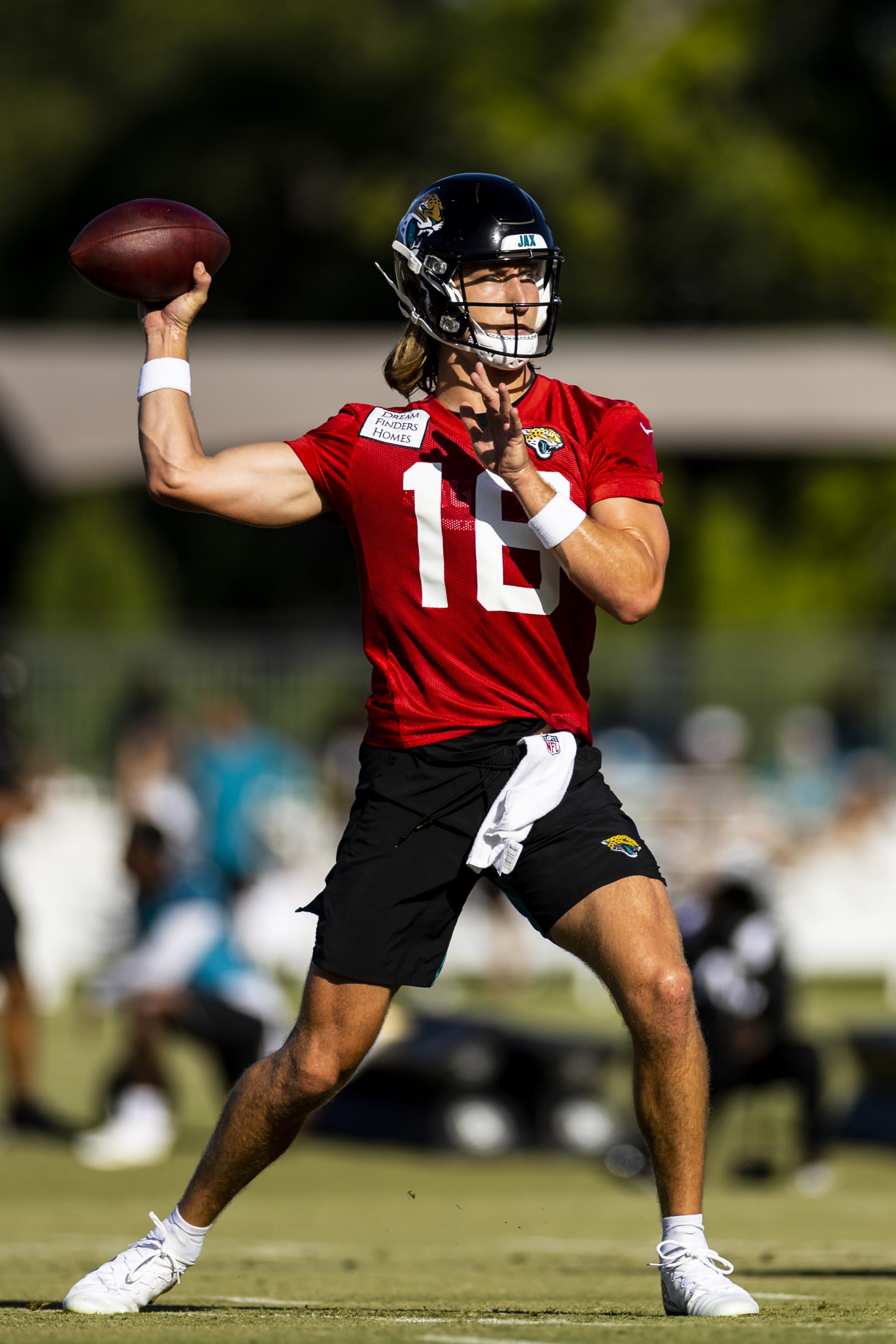 JACKSONVILLE, FLORIDA - JULY 27: Trevor Lawrence #16 of the Jacksonville Jaguars throws a pass during training camp on July 27, 2022 at Episcopal High School in Jacksonville, Florida. (Photo by James Gilbert/Getty Images)