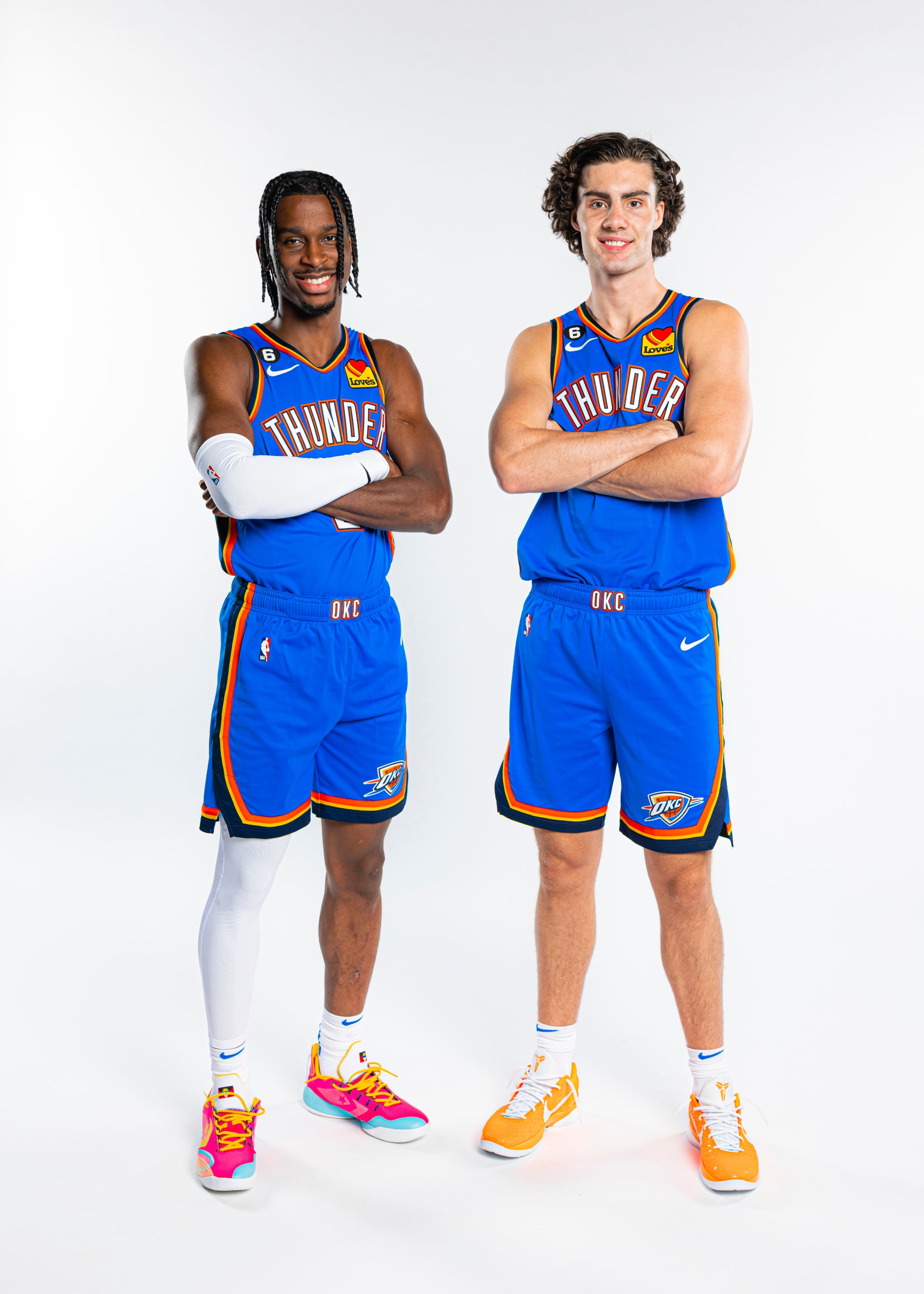 OKLAHOMA CITY, OK - SEPTEMBER 26: Shai Gilgeous-Alexander #2 and Josh Giddey #3 of the Oklahoma City Thunder pose for a portrait during NBA Media Day on September 26, 2022 at the Paycom Center in Oklahoma City, OK. NOTE TO USER: User expressly acknowledges and agrees that, by downloading and/or using this Photograph, user is consenting to the terms and conditions of the Getty Images License Agreement. Mandatory Copyright Notice: Copyright 2022 NBAE (Photo by Zach Beeker/NBAE via Getty Images)