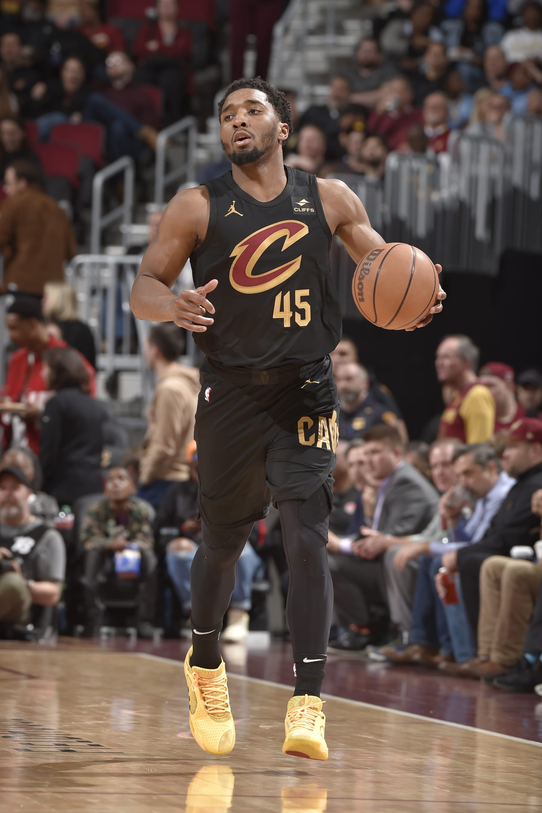CLEVELAND, OH - APRIL 10: Donovan Mitchell #45 of the Cleveland Cavaliers dribbles the ball during the game against the Memphis Grizzlies on April 10, 2024 at Rocket Mortgage FieldHouse in Cleveland, Ohio. NOTE TO USER: User expressly acknowledges and agrees that, by downloading and/or using this Photograph, user is consenting to the terms and conditions of the Getty Images License Agreement. Mandatory Copyright Notice: Copyright 2024 NBAE (Photo by David Liam Kyle/NBAE via Getty Images)