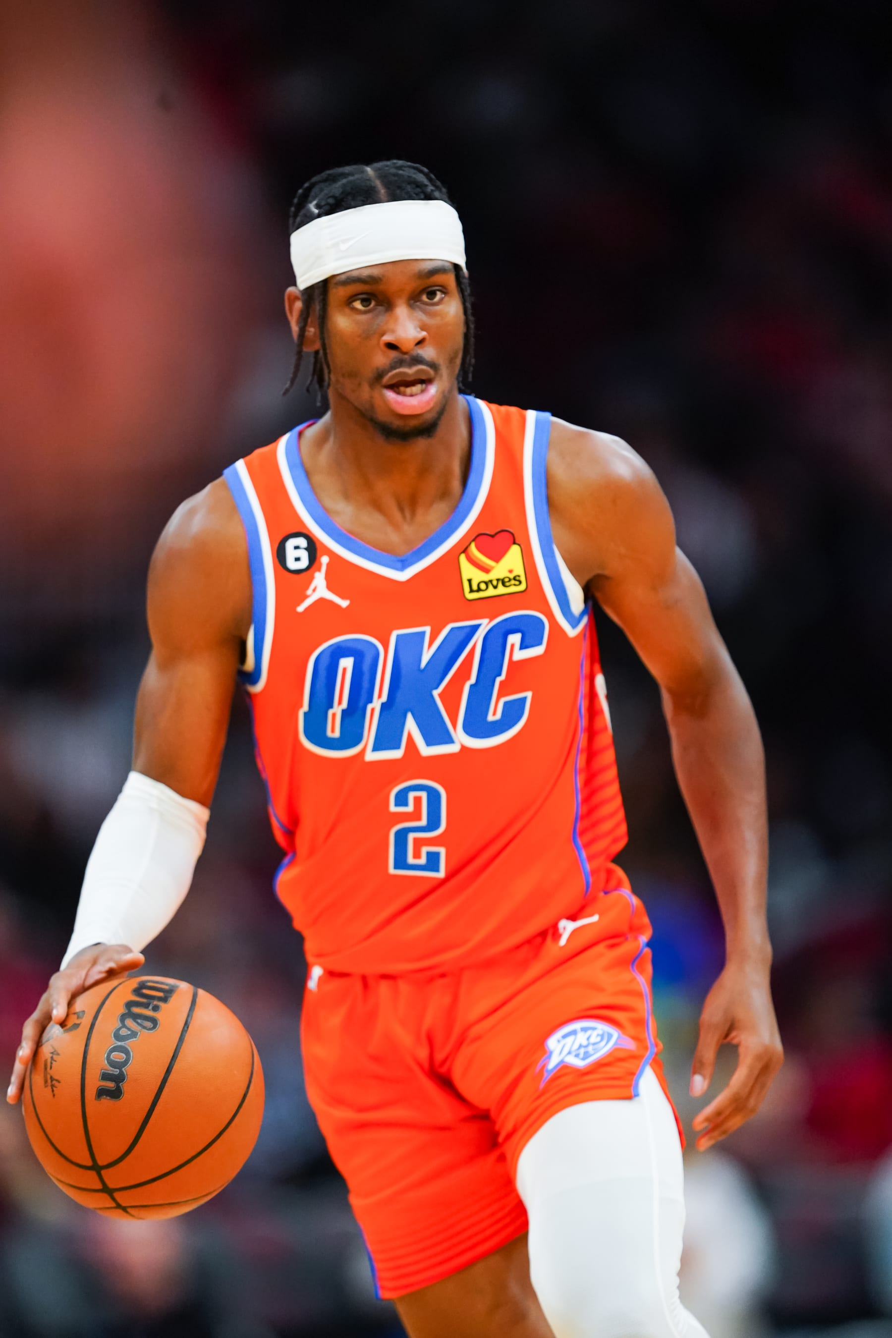 HOUSTON, TEXAS - NOVEMBER 26: Shai Gilgeous-Alexander #2 of the Oklahoma City Thunder dribbles the ball during the game against the Houston Rockets at Toyota Center on November 26, 2022 in Houston, Texas. NOTE TO USER: User expressly acknowledges and agrees that, by downloading and or using this photograph, User is consenting to the terms and conditions of the Getty Images License Agreement. (Photo by Alex Bierens de Haan/Getty Images)