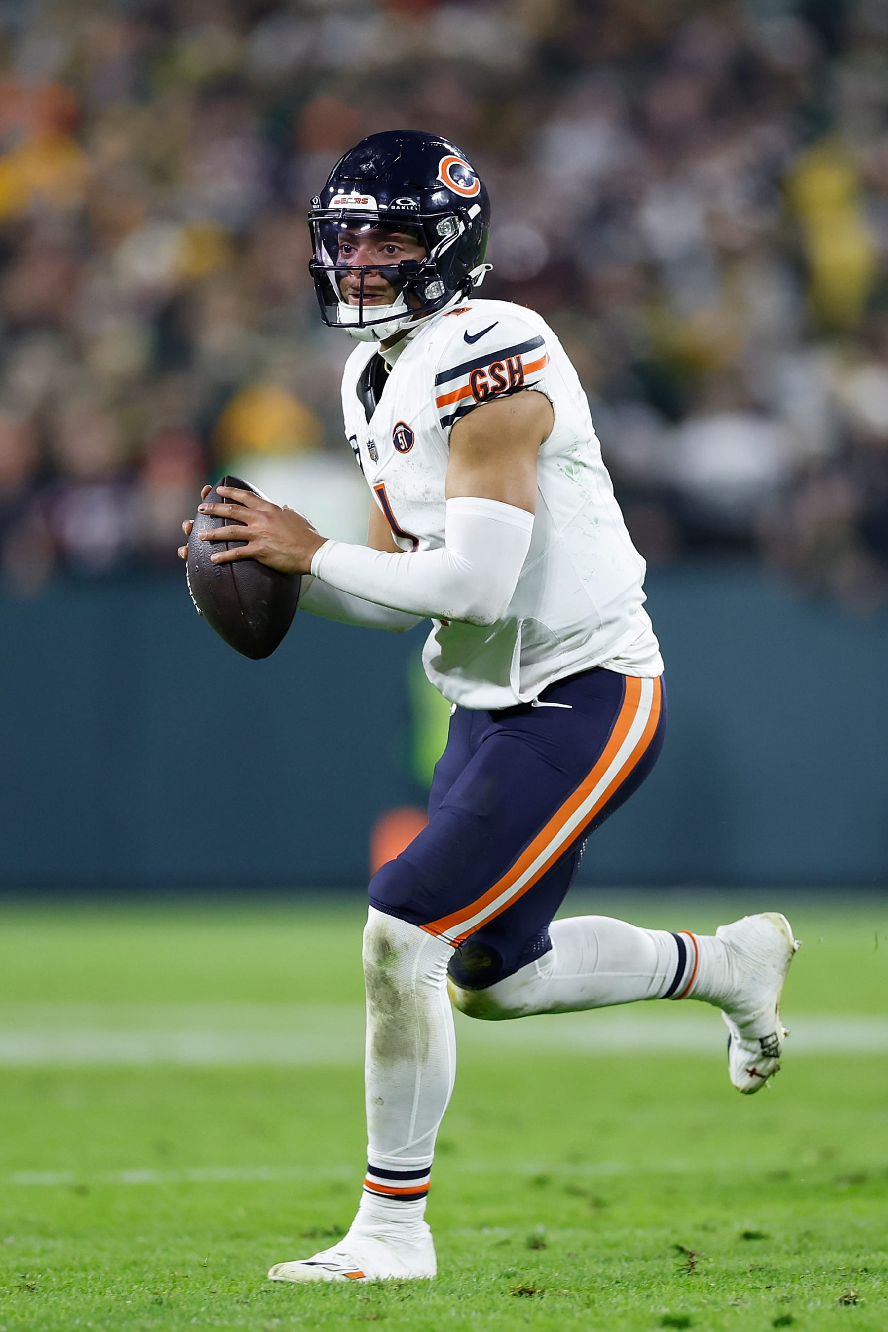 GREEN BAY, WISCONSIN - JANUARY 07: Justin Fields #1 of the Chicago Bears looks to pass against the Green Bay Packers at Lambeau Field on January 07, 2024 in Green Bay, Wisconsin. (Photo by John Fisher/Getty Images)