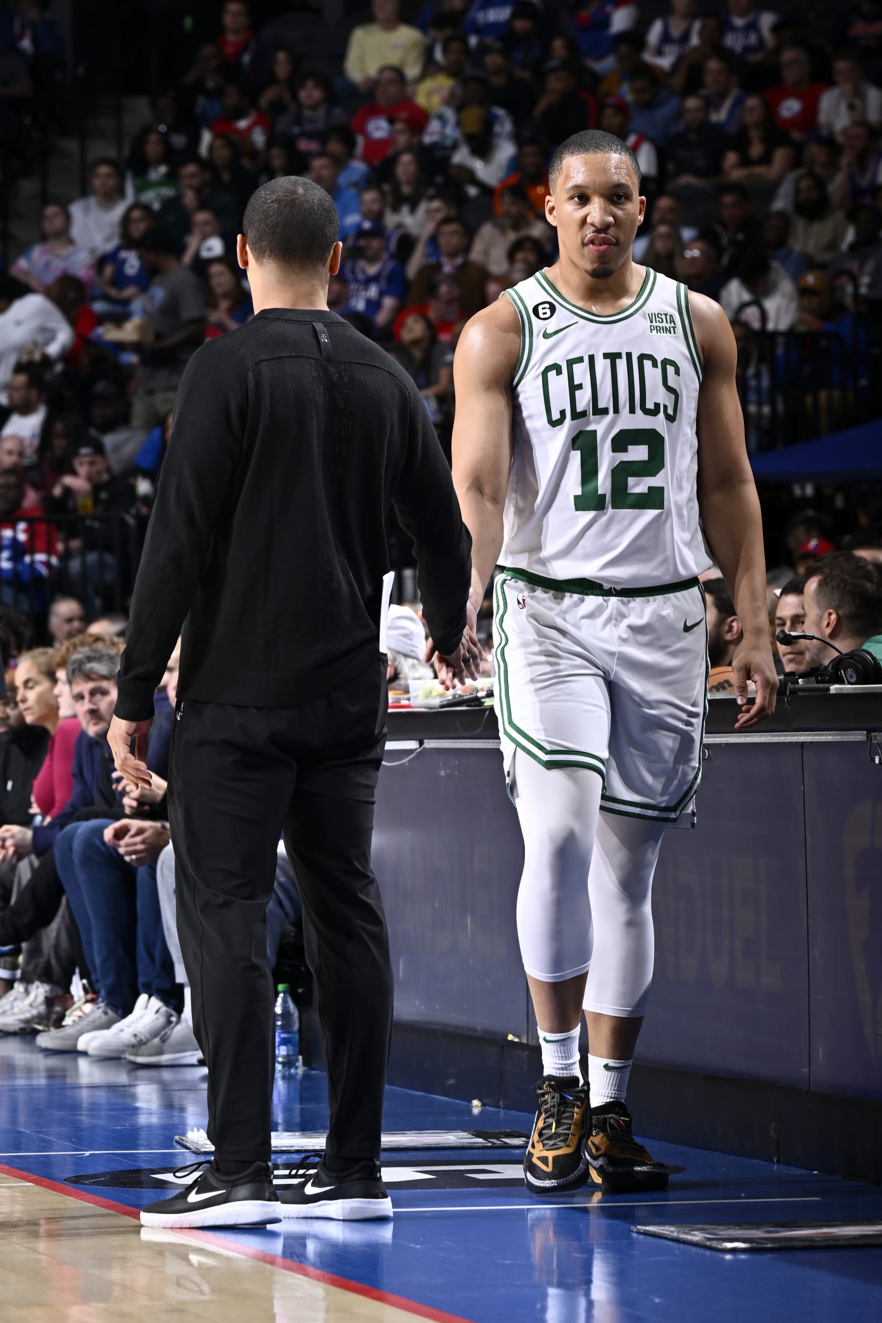 PHILADELPHIA, PA - APRIL 4: Grant Williams #12 of the Boston Celtics high fives Head Coach Joe Mazzulla of the Boston Celtics during the game against the Philadelphia 76ers on April 4, 2023 at the Wells Fargo Center in Philadelphia, Pennsylvania NOTE TO USER: User expressly acknowledges and agrees that, by downloading and/or using this Photograph, user is consenting to the terms and conditions of the Getty Images License Agreement. Mandatory Copyright Notice: Copyright 2023 NBAE (Photo by David Dow/NBAE via Getty Images)