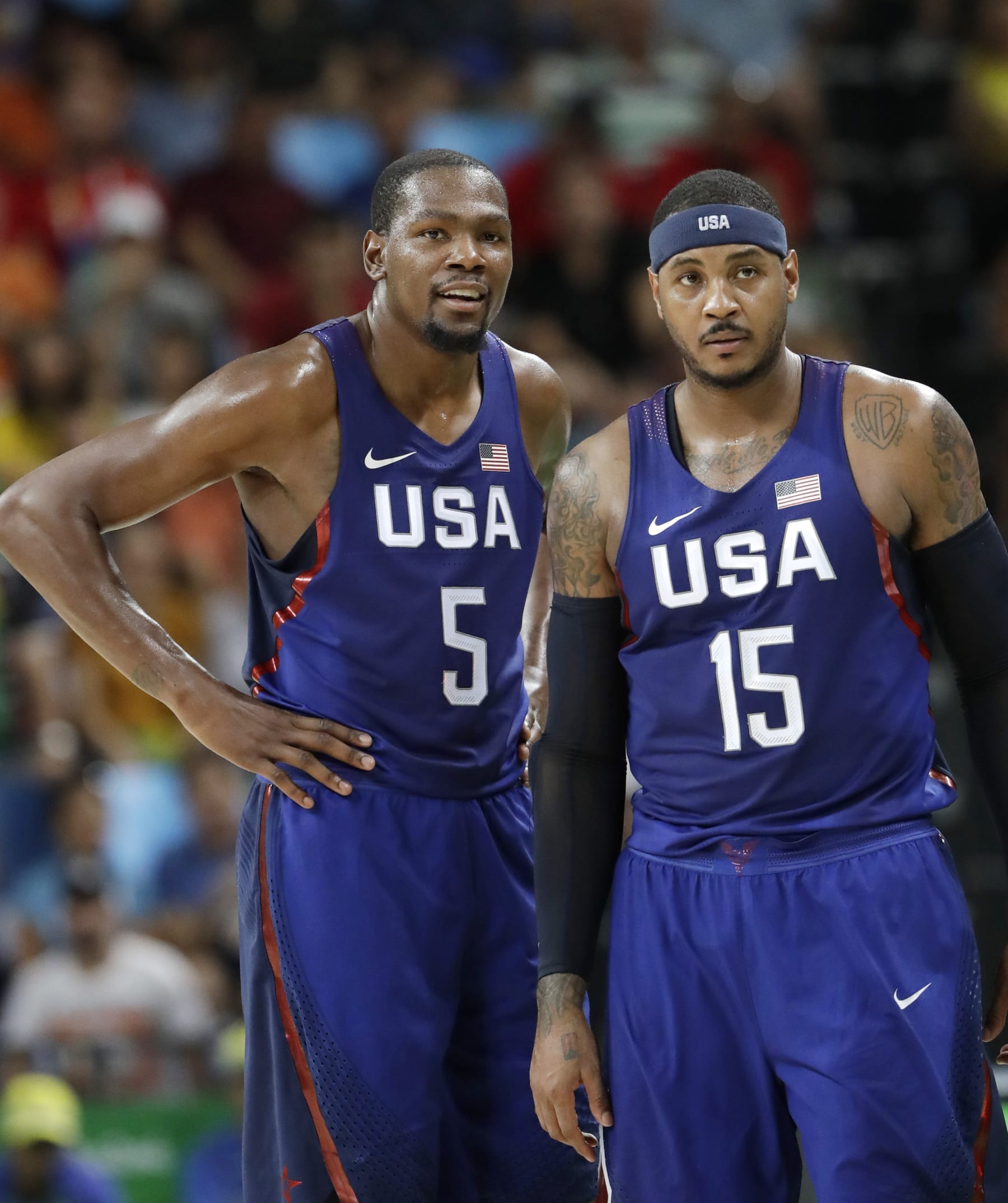 United States’ Kevin Durant (5) stands with teammate Carmelo Anthony (15) as questions a foul call during a men's semifinal round basketball game against Spain at the 2016 Summer Olympics in Rio de Janeiro, Brazil, Friday, Aug. 19, 2016. (AP Photo/Eric Gay)