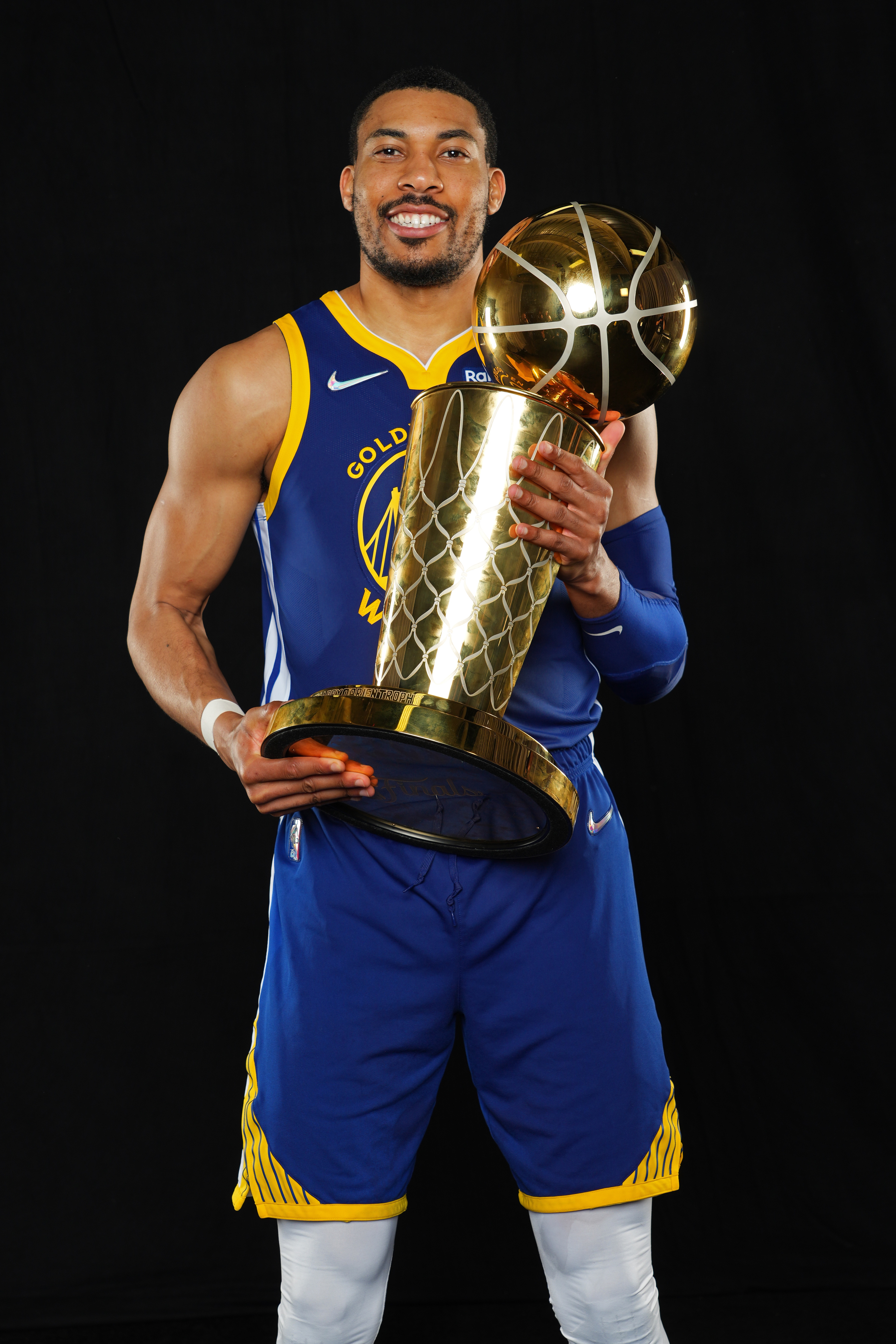 BOSTON, MA - JUNE 16: Otto Porter Jr. #32 of the Golden State Warriors poses for a portrait with the Larry OBrien Trophy after winning Game Six of the 2022 NBA Finals against the Boston Celtics on June 16, 2022 at TD Garden in Boston, Massachusetts. NOTE TO USER: User expressly acknowledges and agrees that, by downloading and or using this photograph, user is consenting to the terms and conditions of Getty Images License Agreement. Mandatory Copyright Notice: Copyright 2022 NBAE (Photo by Jesse D. Garrabrant/NBAE via Getty Images)