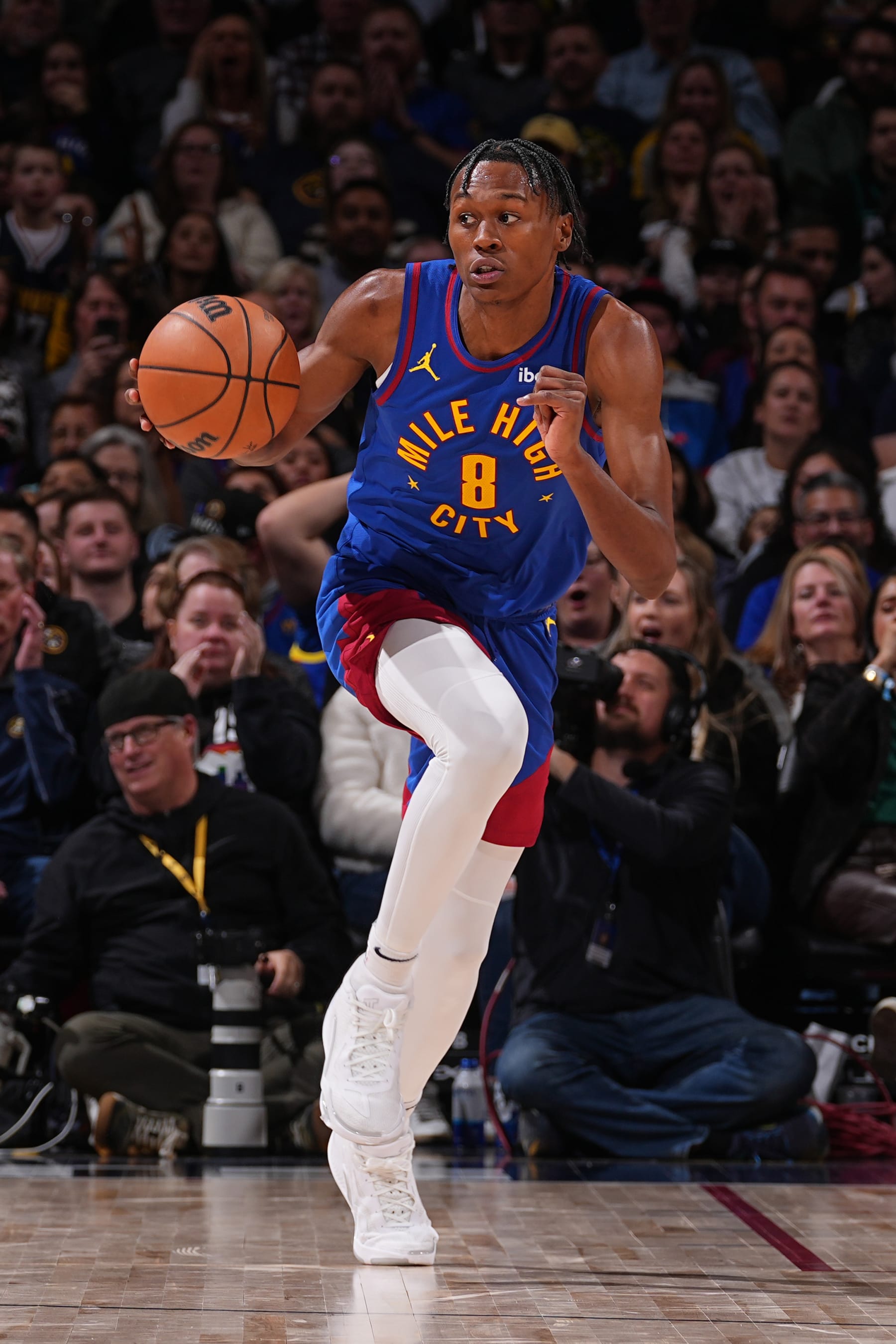 DENVER, CO - FEBRUARY 2: Peyton Watson #8 of the Denver Nuggets dribbles the ball during the game against the Portland Trail Blazers on February 2, 2024 at the Ball Arena in Denver, Colorado. NOTE TO USER: User expressly acknowledges and agrees that, by downloading and/or using this Photograph, user is consenting to the terms and conditions of the Getty Images License Agreement. Mandatory Copyright Notice: Copyright 2024 NBAE (Photo by Bart Young/NBAE via Getty Images)