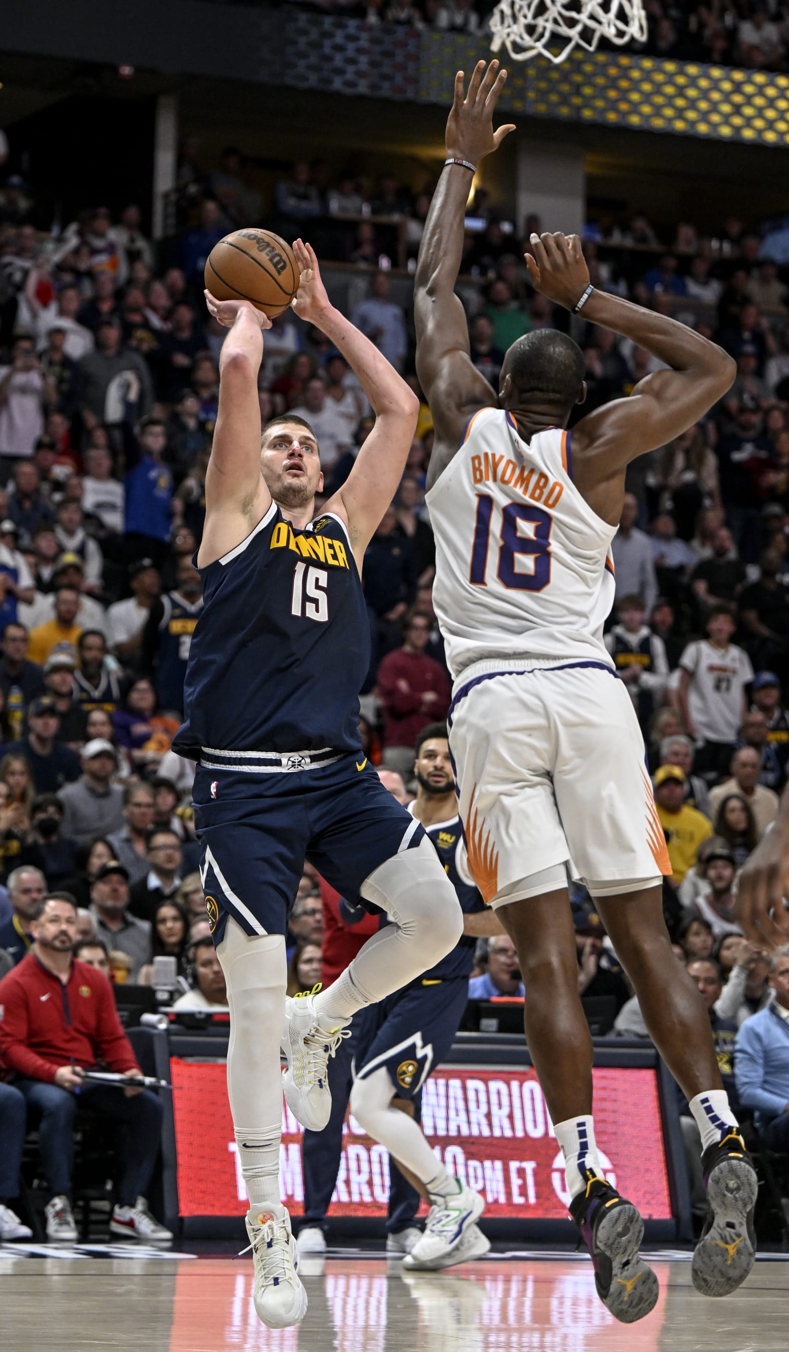 DENVER, CO - MAY 1: Nikola Jokic (15) of the Denver Nuggets shoots over Bismack Biyombo (18) of the Phoenix Suns during the third quarter at Ball Arena in Denver on Monday, May 1, 2023. (Photo by AAron Ontiveroz/MediaNews Group/The Denver Post via Getty Images)