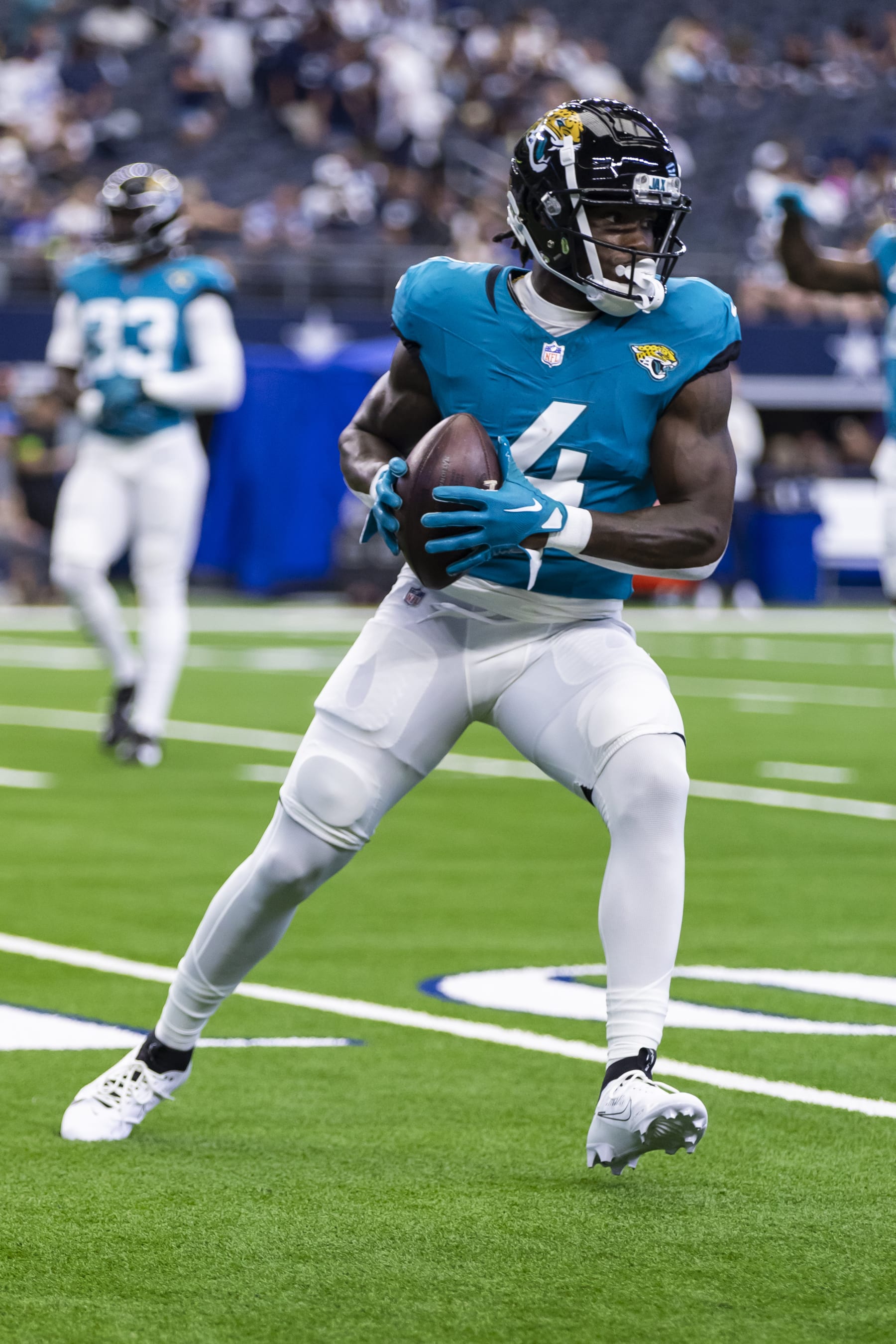 Jacksonville Jaguars running back Tank Bigsby (4) is seen during warm ups before an NFL football game against the Dallas Cowboys, Saturday, Aug. 12, 2023, in Arlington, Texas. Jacksonville won 28-23. (AP Photo/Brandon Wade)
