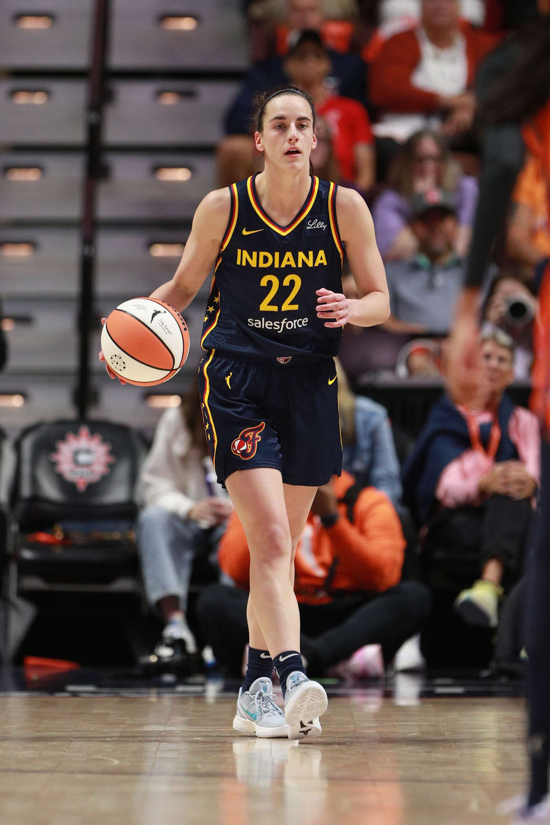 UNCASVILLE, CT - SEPTEMBER 22: Caitlin Clark #22 of the Indiana Fever dribbles the ball during the game against the Connecticut Sun during round one game one of the 2024 WNBA Playoffs on September 22, 2024 at the Mohegan Sun Arena in Uncasville, Connecticut. NOTE TO USER: User expressly acknowledges and agrees that, by downloading and or using this photograph, User is consenting to the terms and conditions of the Getty Images License Agreement. Mandatory Copyright Notice: Copyright 2024 NBAE (Photo by Chris Marion/NBAE via Getty Images)