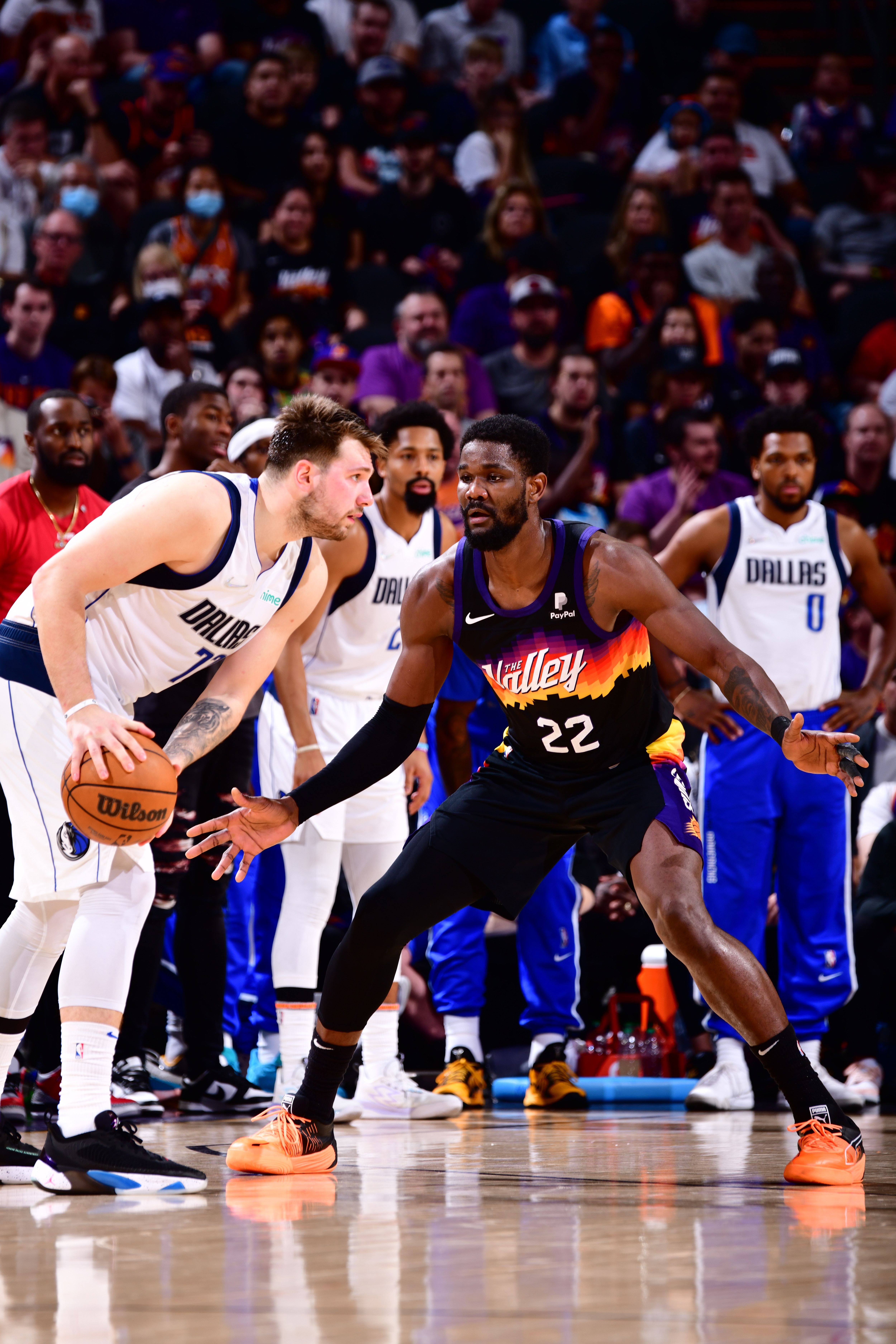 PHOENIX, AZ - MAY 2: Deandre Ayton #22 of the Phoenix Suns plays defense on Luka Doncic #77 of the Dallas Mavericks during Game 1 of the 2022 NBA Playoffs Western Conference Semifinals on May 2, 2022 at Footprint Center in Phoenix, Arizona. NOTE TO USER: User expressly acknowledges and agrees that, by downloading and or using this photograph, user is consenting to the terms and conditions of the Getty Images License Agreement. Mandatory Copyright Notice: Copyright 2022 NBAE (Photo by Barry Gossage/NBAE via Getty Images)