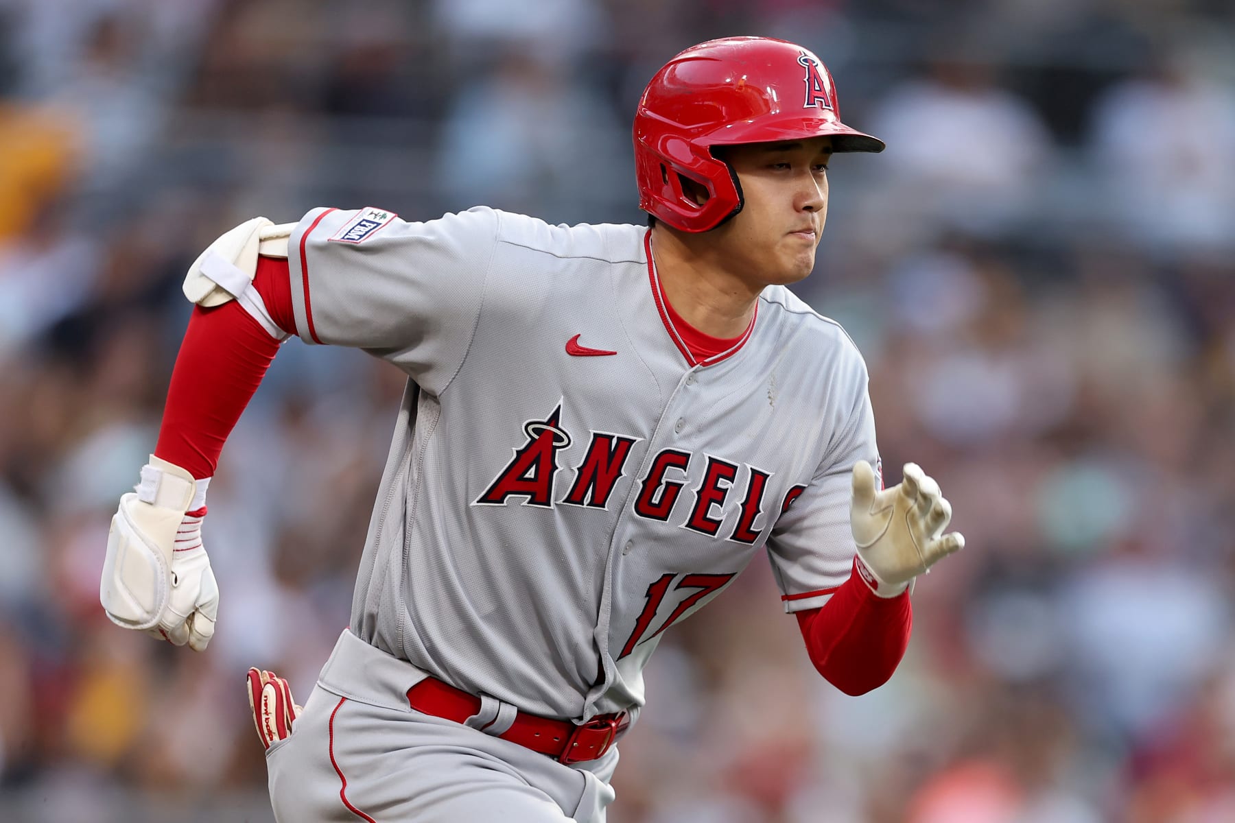 SAN DIEGO, CALIFORNIA - JULY 03: Shohei Ohtani #17 of the Los Angeles Angels runs to first base during a game against the San Diego Padres at PETCO Park on July 03, 2023 in San Diego, California. (Photo by Sean M. Haffey/Getty Images)