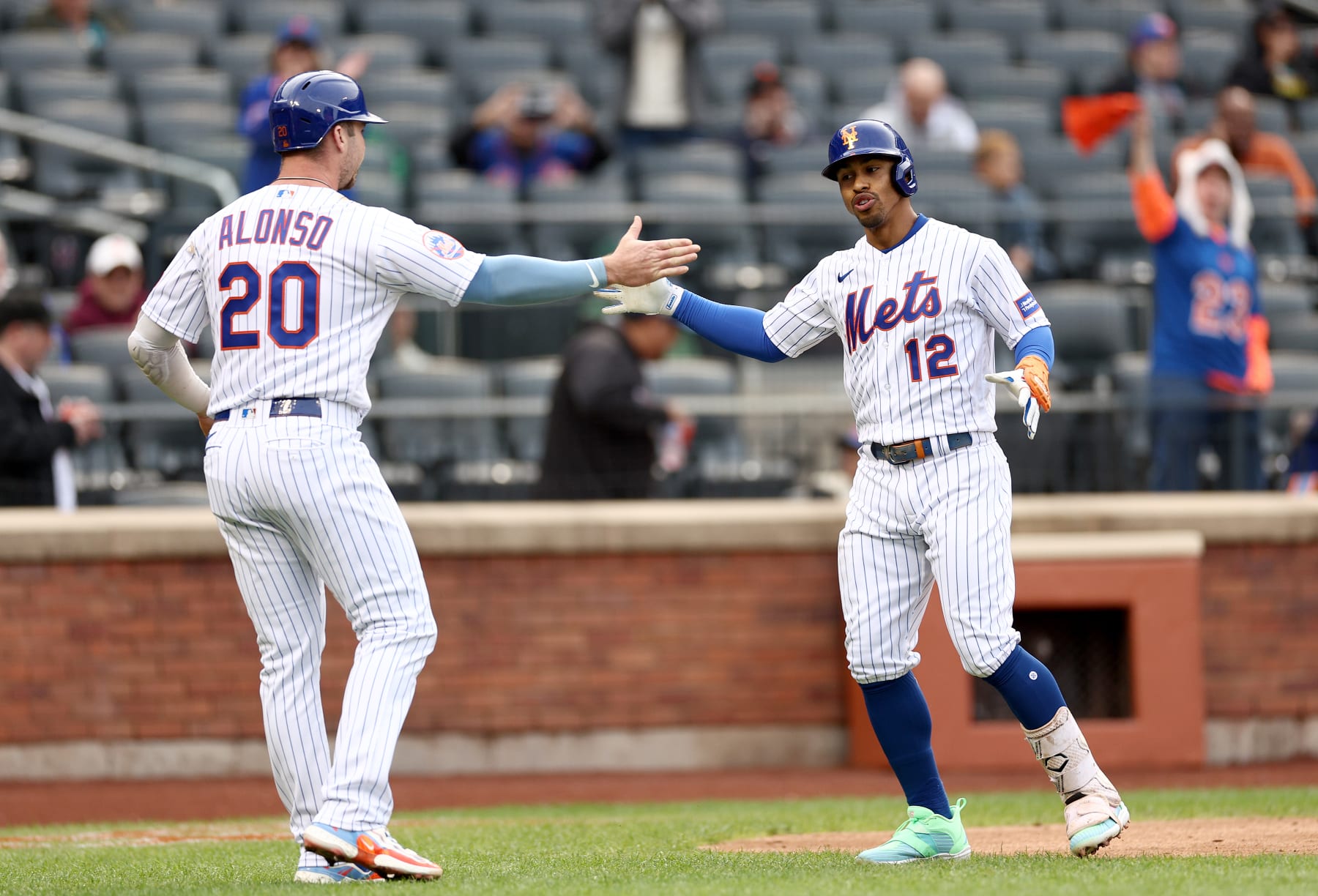 NEW YORK, NEW YORK - SEPTEMBER 27: Francisco Lindor #12 of the New York Mets celebrates his two run home run with teammate Pete Alonso in the third inning against the Miami Marlins during game one of a double header at Citi Field on September 27, 2023 in the Flushing neighborhood of the Queens borough of New York City. Pete Alonso #20 and Francisco Lindor #12 of the New York Mets scored on the play. (Photo by Elsa/Getty Images)