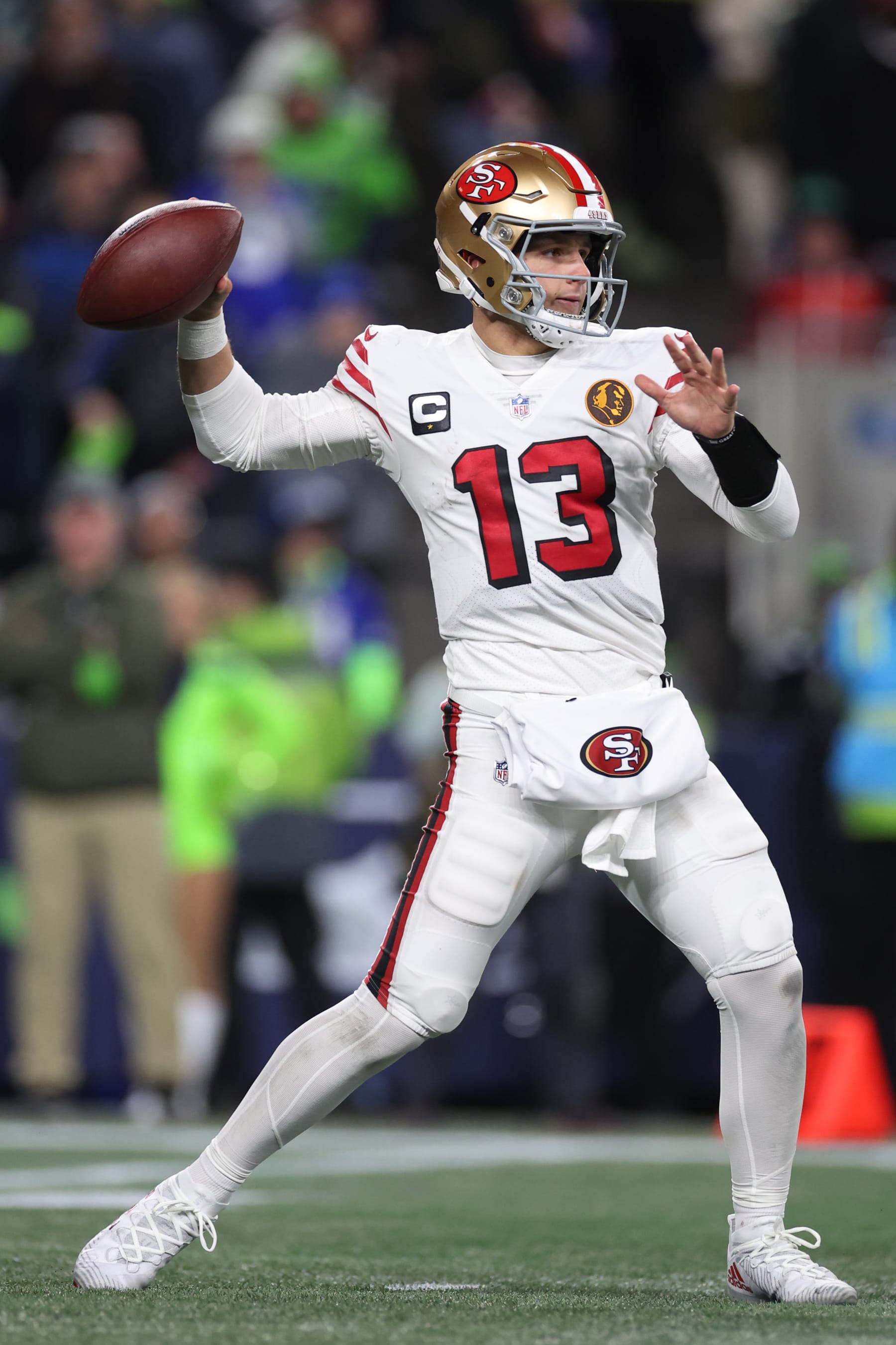 SEATTLE, WASHINGTON - NOVEMBER 23: Brock Purdy #13 of the San Francisco 49ers throws a pass during the third quarter against the Seattle Seahawks at Lumen Field on November 23, 2023 in Seattle, Washington. (Photo by Steph Chambers/Getty Images)