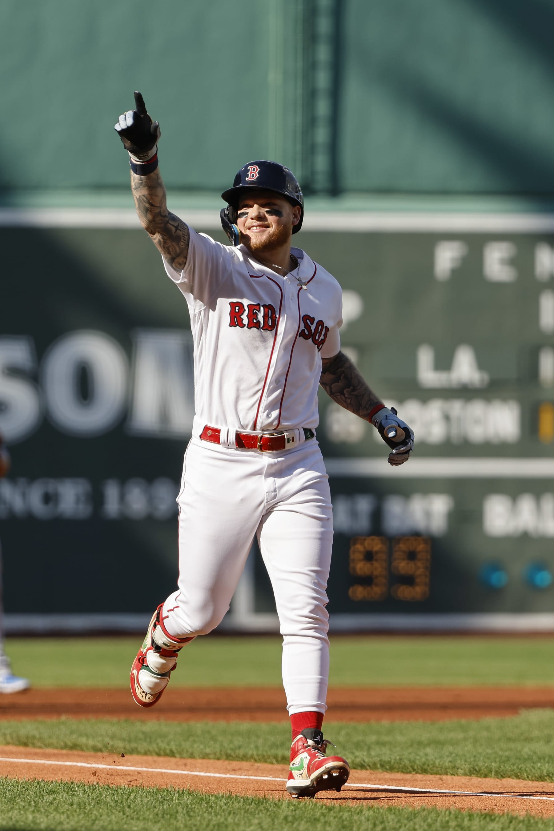 BOSTON, MA - AUGUST 26: Alex Verdugo #99 of the Boston Red Sox points to the stands after his home run against the Los Angeles Dodgers during the first inning at Fenway Park on August 26, 2023 in Boston, Massachusetts. (Photo By Winslow Townson/Getty Images)