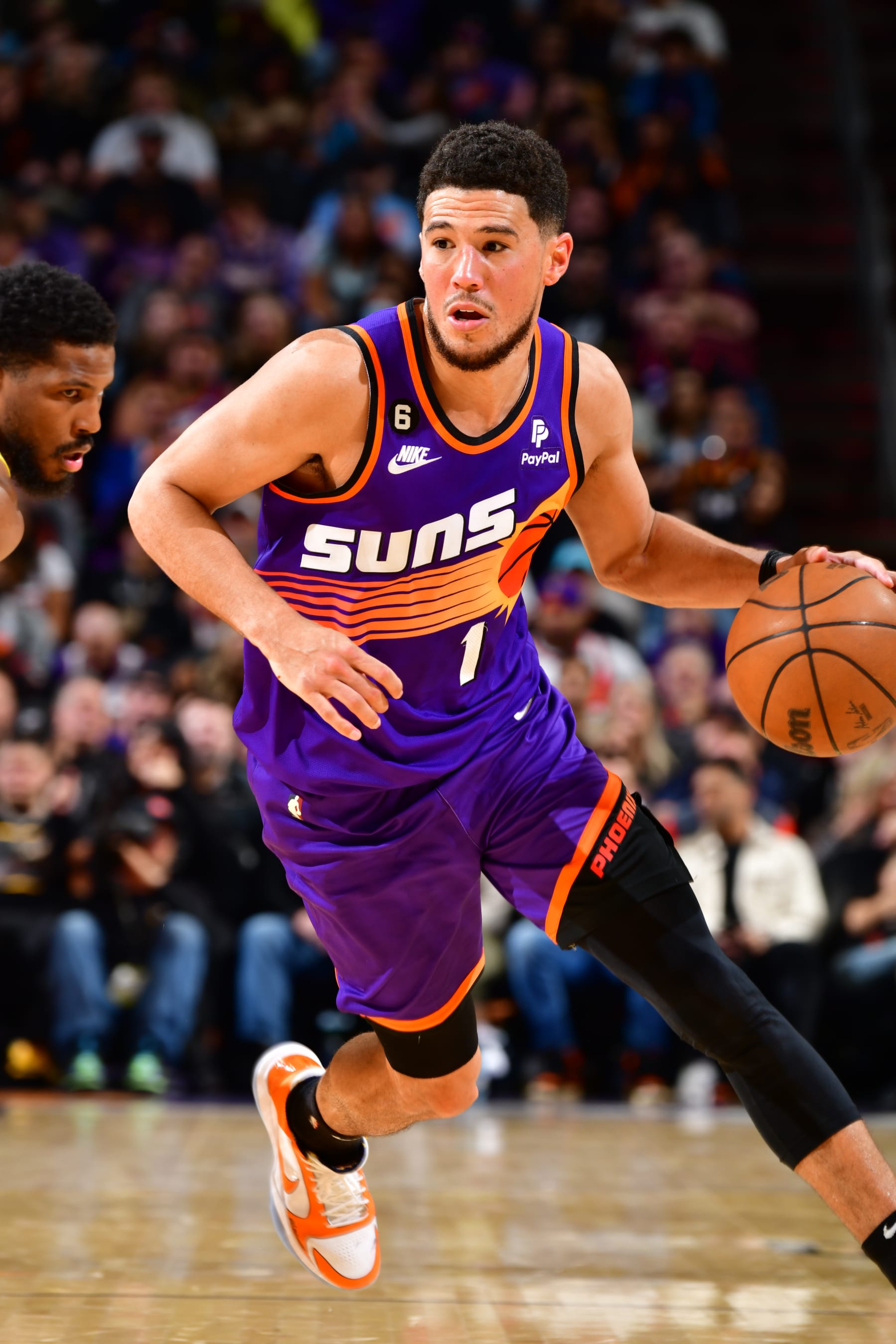 PHOENIX, AZ - NOVEMBER 26: Devin Booker #1 of the Phoenix Suns moves the ball during the game against the Utah Jazz on November 26, 2022 at Footprint Center in Phoenix, Arizona. NOTE TO USER: User expressly acknowledges and agrees that, by downloading and or using this photograph, user is consenting to the terms and conditions of the Getty Images License Agreement. Mandatory Copyright Notice: Copyright 2022 NBAE (Photo by Barry Gossage/NBAE via Getty Images)