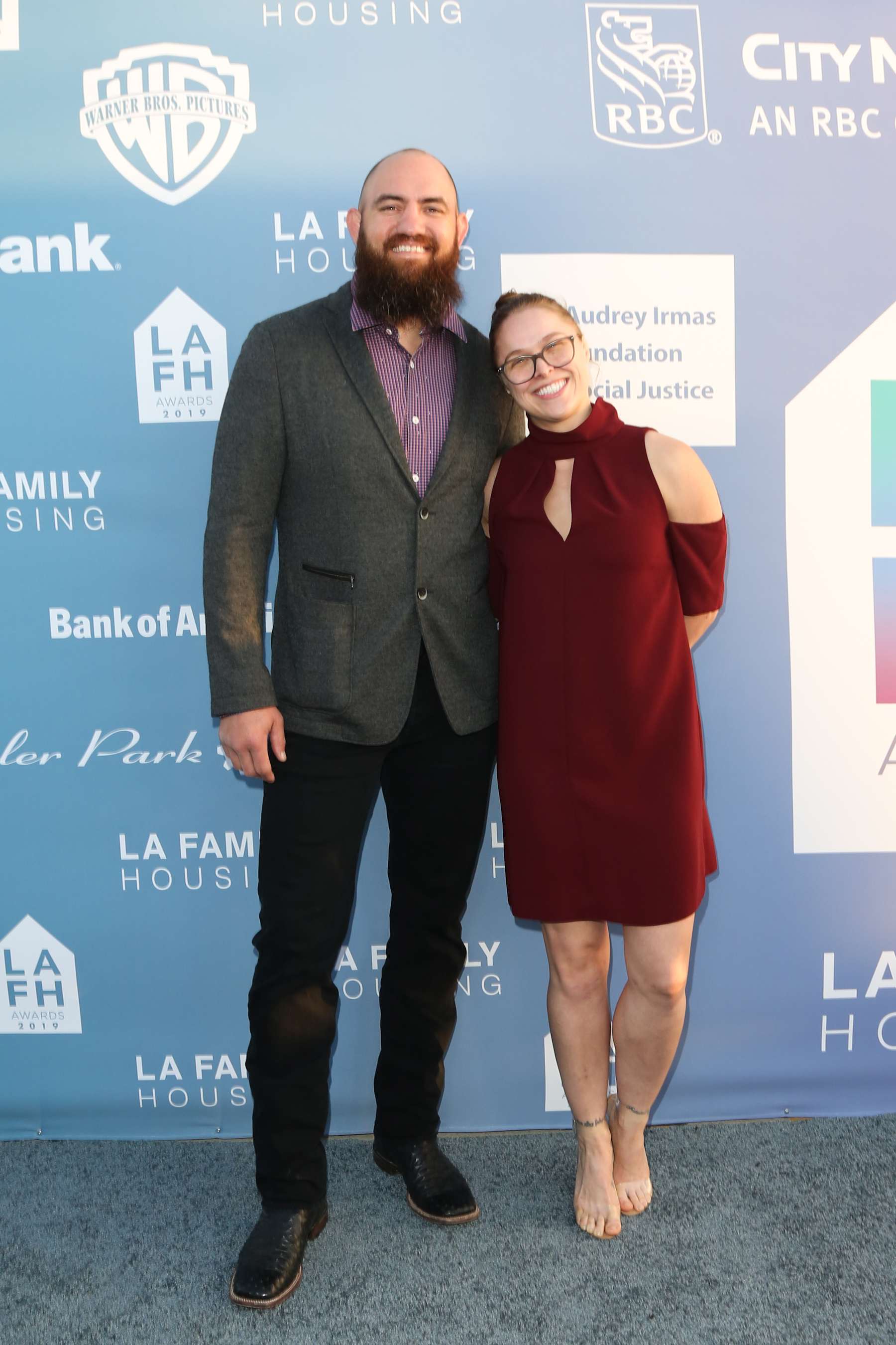 WEST HOLLYWOOD, CALIFORNIA - APRIL 25: MMA Fighter Travis Browne (L) and WWE Wrestler Ronda Rousey (R) attend the LA Family Housing Annual LAFH Awards and fundraiser celebration at The Lot on April 25, 2019 in West Hollywood, California. (Photo by Paul Archuleta/FilmMagic)
