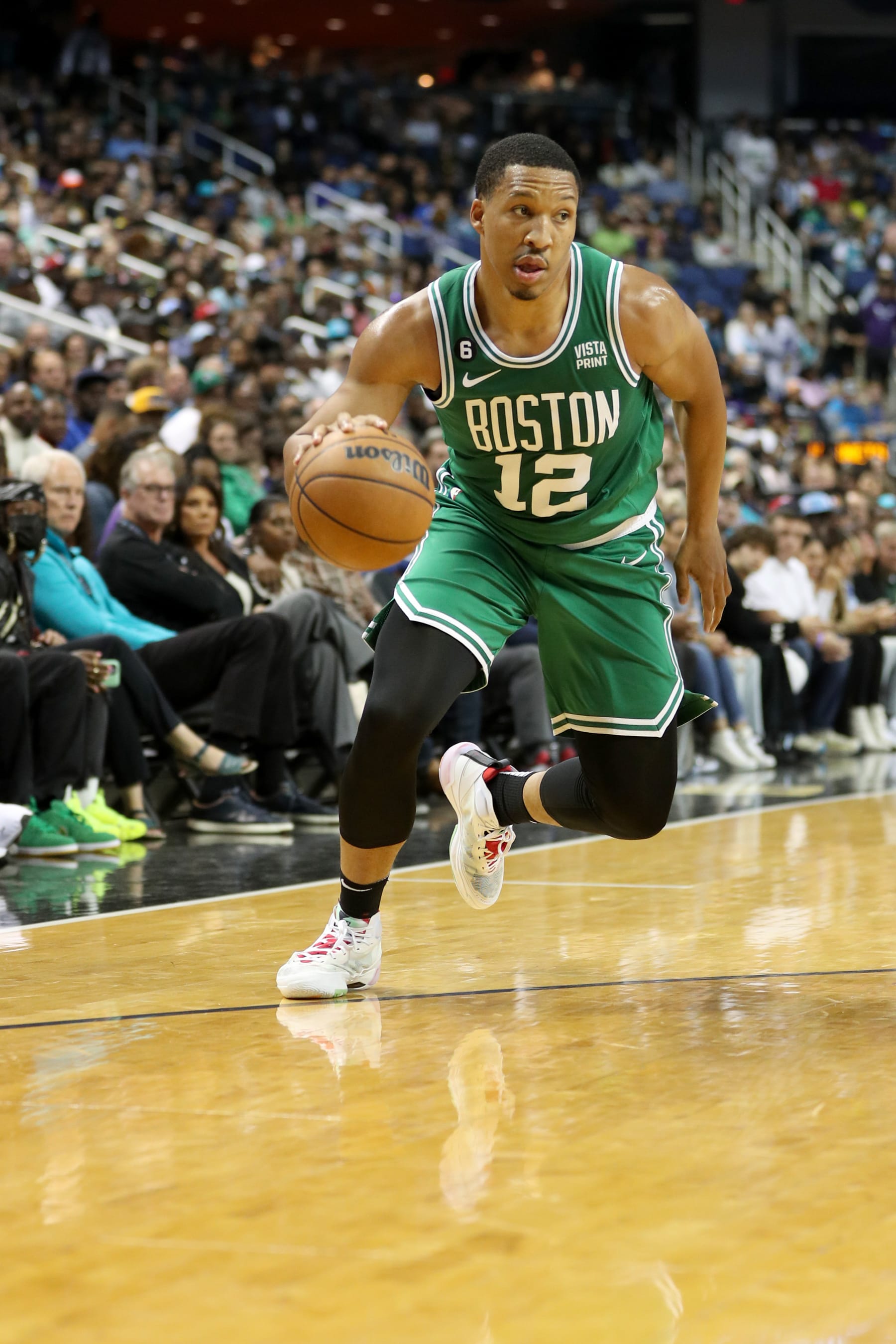 CHARLOTTE, NC - OCTOBER 7:Grant Williams #12 of the Boston Celtics dribbles the ball against the Charlotte Hornets on October 7, 2022 at Greensboro Coliseum Complex in Greensboro,  North Carolina. NOTE TO USER: User expressly acknowledges and agrees that, by downloading and or using this photograph, User is consenting to the terms and conditions of the Getty Images License Agreement.  Mandatory Copyright Notice:  Copyright 2022 NBAE (Photo by Brock Williams-Smith/NBAE via Getty Images)