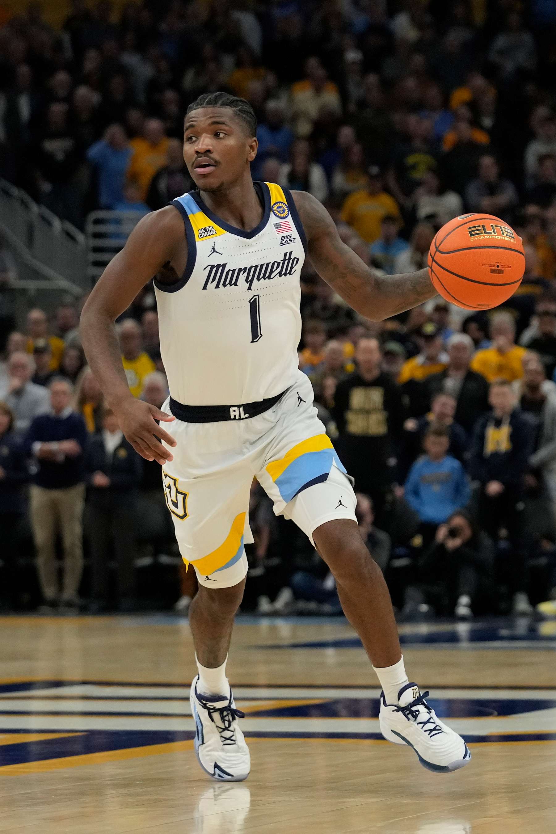 MILWAUKEE, WISCONSIN - JANUARY 07: Kam Jones #1 of the Marquette Golden Eagles dribbles the ball against the Georgetown Hoyas during the first half at Fiserv Forum on January 07, 2025 in Milwaukee, Wisconsin. (Photo by Patrick McDermott/Getty Images)