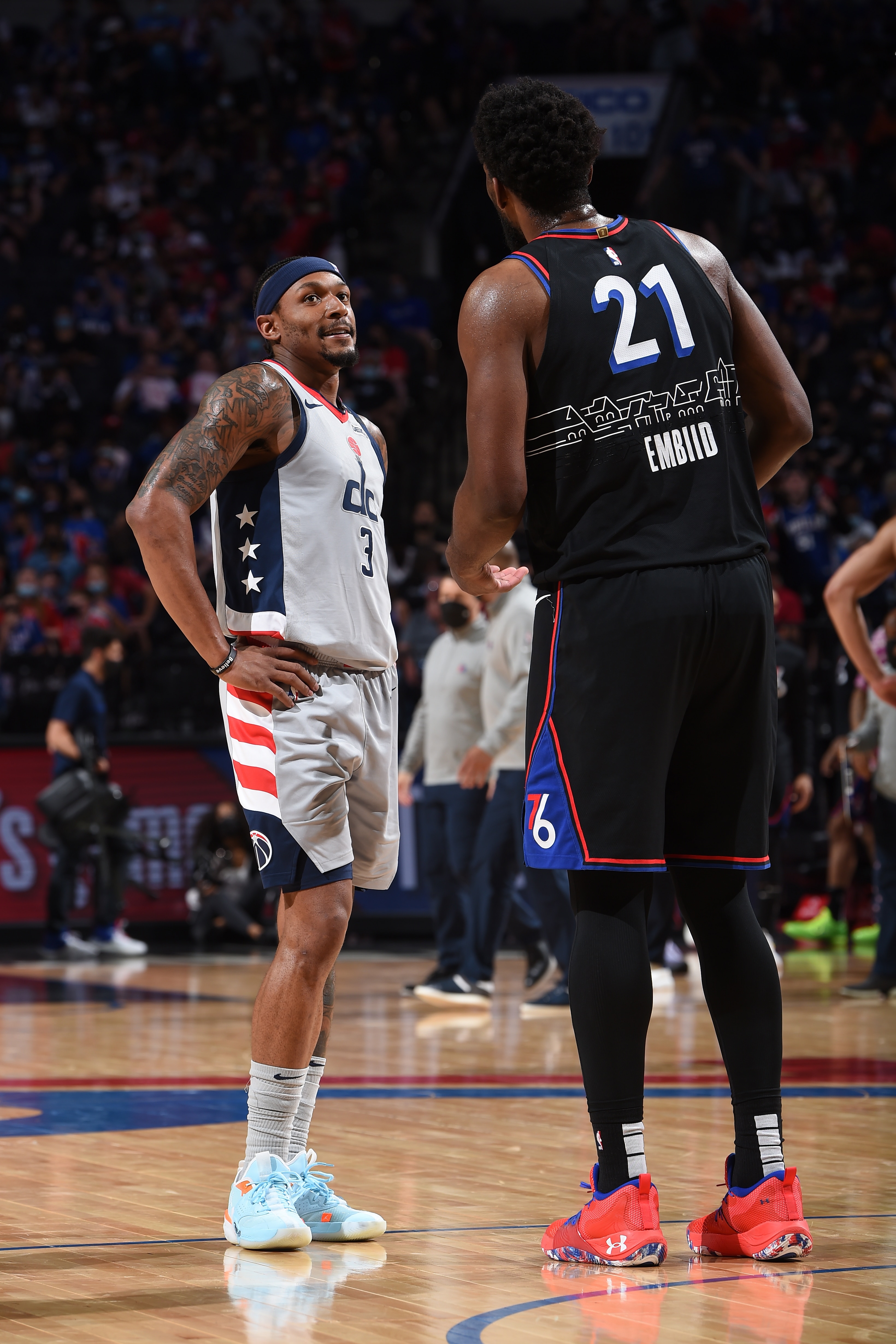 PHILADELPHIA, PA - MAY 26: Bradley Beal #3 of the Washington Wizards and Joel Embiid #21 of the Philadelphia 76ers talk during Round One Game Two of the Eastern Conference Playoffs on May 26, 2021 at Wells Fargo Center in Philadelphia, Pennsylvania. NOTE TO USER: User expressly acknowledges and agrees that, by downloading and/or using this Photograph, user is consenting to the terms and conditions of the Getty Images License Agreement. Mandatory Copyright Notice: Copyright 2021 NBAE (Photo by David Dow/NBAE via Getty Images)