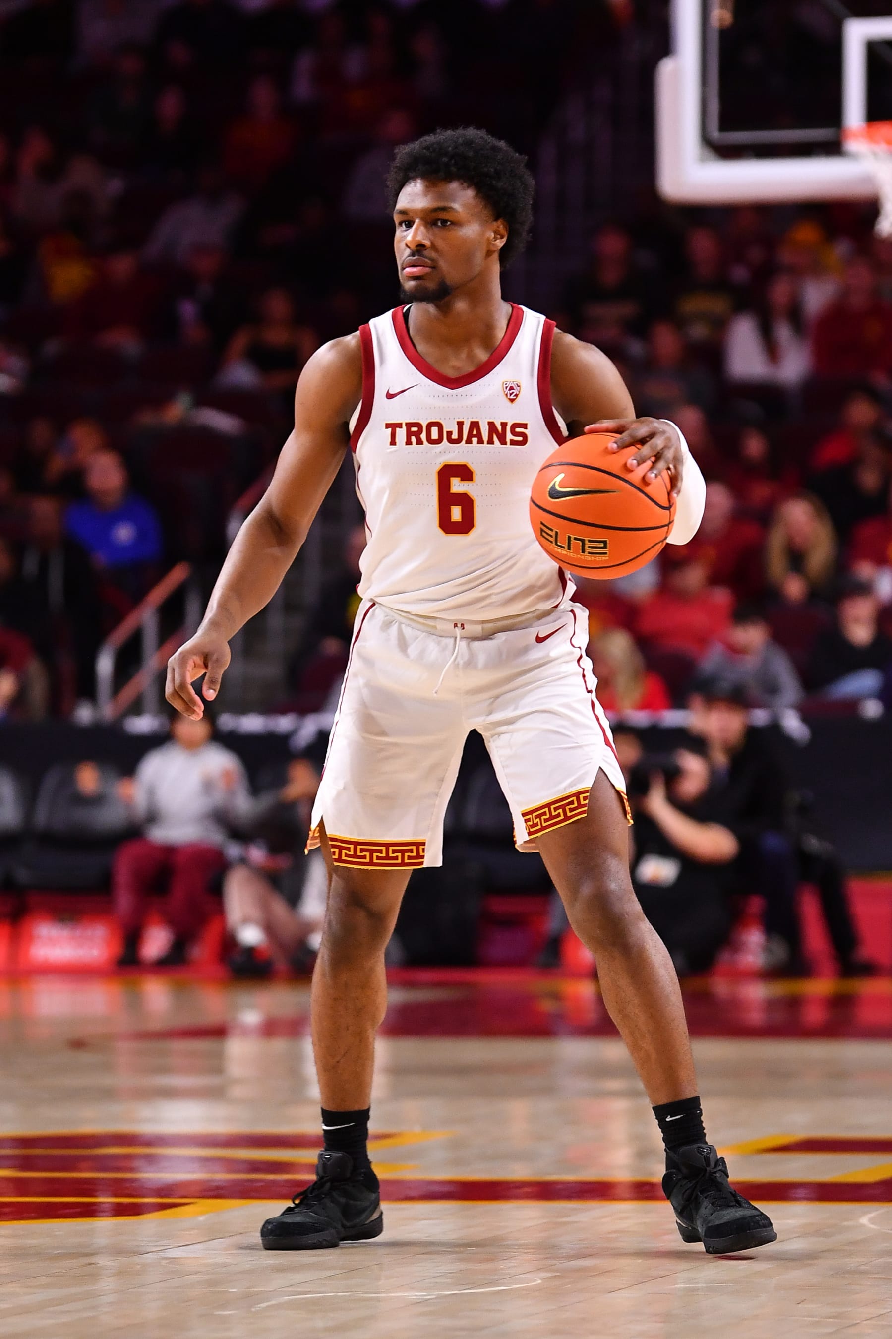 LOS ANGELES, CA - FEBRUARY 17: USC Trojans guard Bronny James (6) dribbles up the court during the college basketball game between the Colorado Buffaloes and the USC Trojans on February 17, 2024 at Galen Center in Los Angeles, CA. (Photo by Brian Rothmuller/Icon Sportswire via Getty Images)