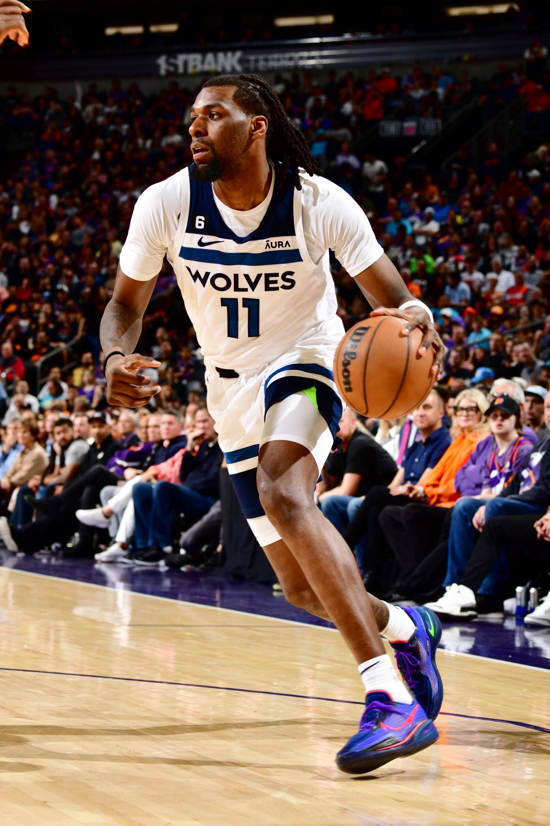 PHOENIX, AZ - MARCH 29: Naz Reid #11 of the Minnesota Timberwolves dribbles the ball during the game against the Phoenix Suns on March 29, 2022 at Footprint Center in Phoenix, Arizona. NOTE TO USER: User expressly acknowledges and agrees that, by downloading and or using this photograph, user is consenting to the terms and conditions of the Getty Images License Agreement. Mandatory Copyright Notice: Copyright 2022 NBAE (Photo by Barry Gossage/NBAE via Getty Images)