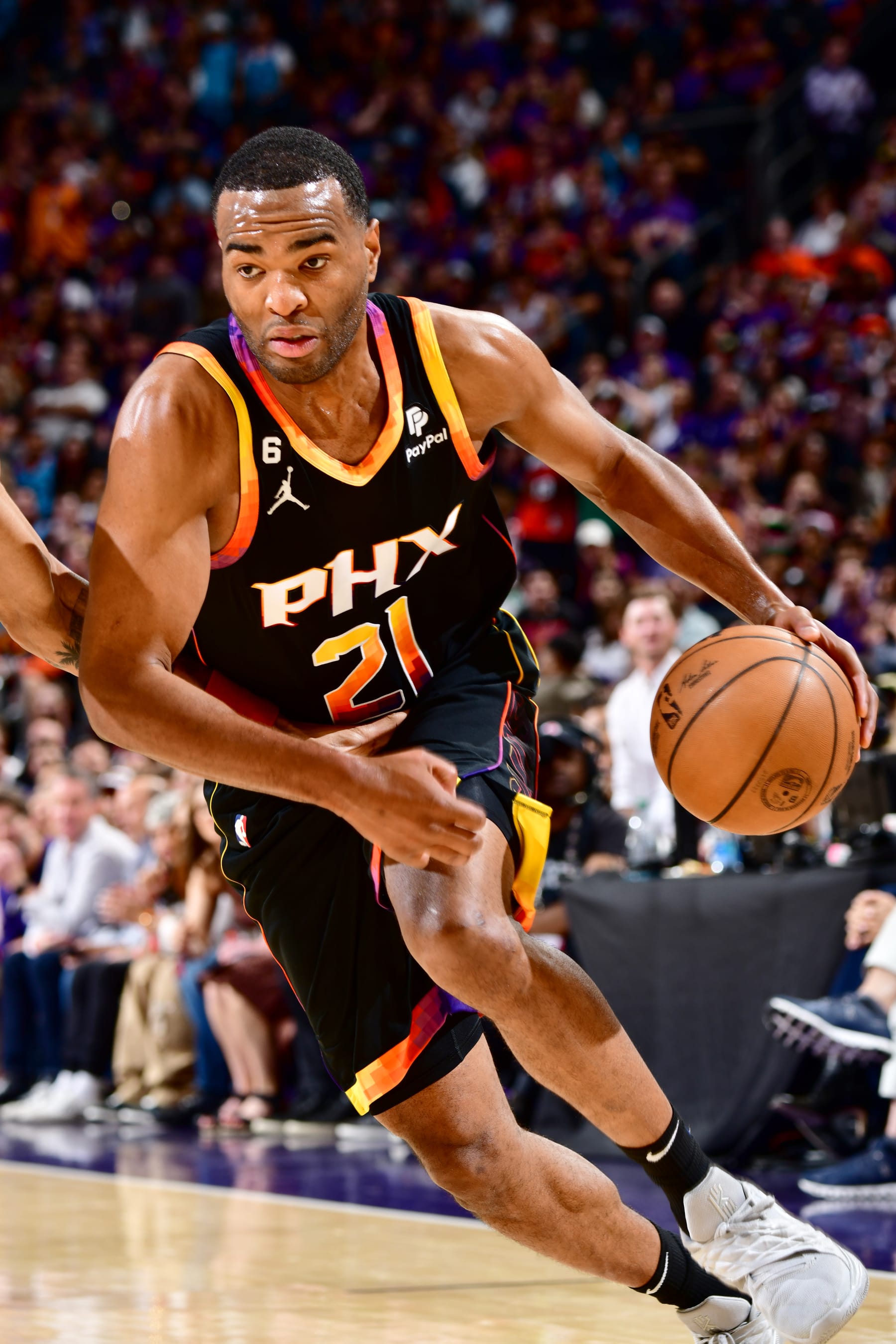 PHOENIX, AZ - MAY 5: T.J. Warren #21 of the Phoenix Suns dribbles the ball during Game 3 of the 2023 NBA Playoffs Western Conference Semi-Finals against the Denver Nuggets on May 5, 2023 at Footprint Center in Phoenix, Arizona. NOTE TO USER: User expressly acknowledges and agrees that, by downloading and or using this photograph, user is consenting to the terms and conditions of the Getty Images License Agreement. Mandatory Copyright Notice: Copyright 2023 NBAE (Photo by Barry Gossage/NBAE via Getty Images)