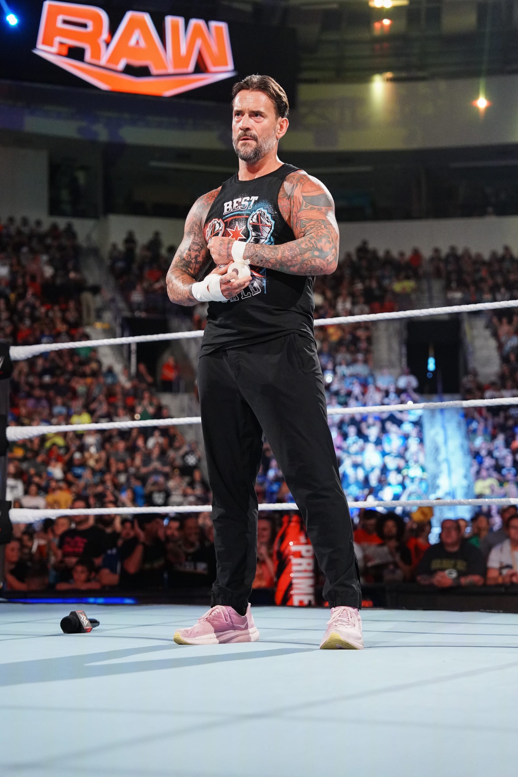 GREEN BAY, WISCONSIN - JULY 22: CM Punk stands in ring during Monday Night RAW at Resch Center on July 22, 2024 in Green Bay, Wisconsin.  (Photo by WWE/Getty Images)