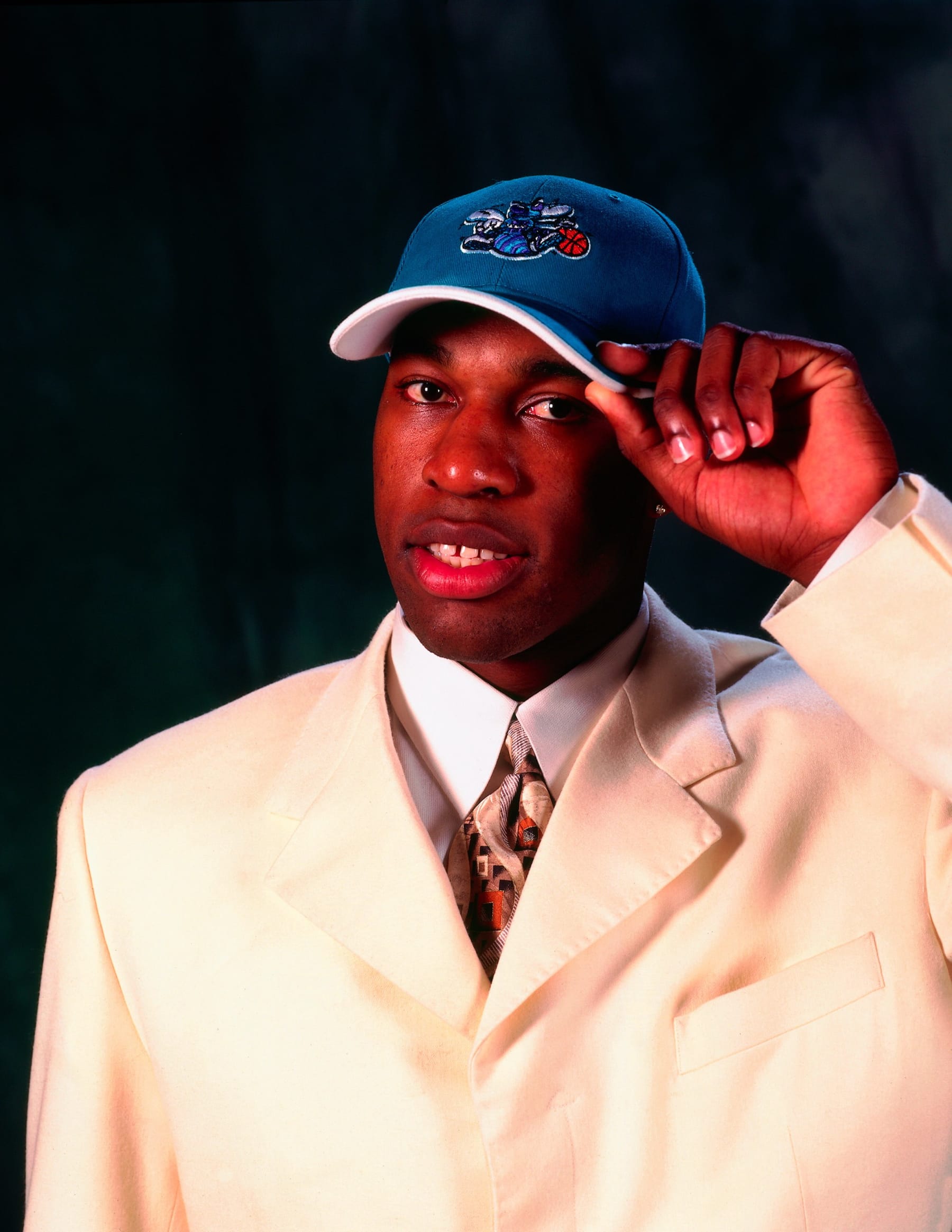 WASHINGTON, DC - JUNE 30:  Baron Davis of the Charlotte Hornets poses for a portrait during the 1999 NBA Draft on June 30, 1999 at the MCI Center in Washington, DC. NOTE TO USER: User expressly acknowledges and agrees that, by downloading and or using this photograph, User is consenting to the terms and conditions of the Getty Images License Agreement. Mandatory Copyright Notice: Copyright 1999 NBAE (Photo by Andrew D. Bernstein/NBAE via Getty Images)