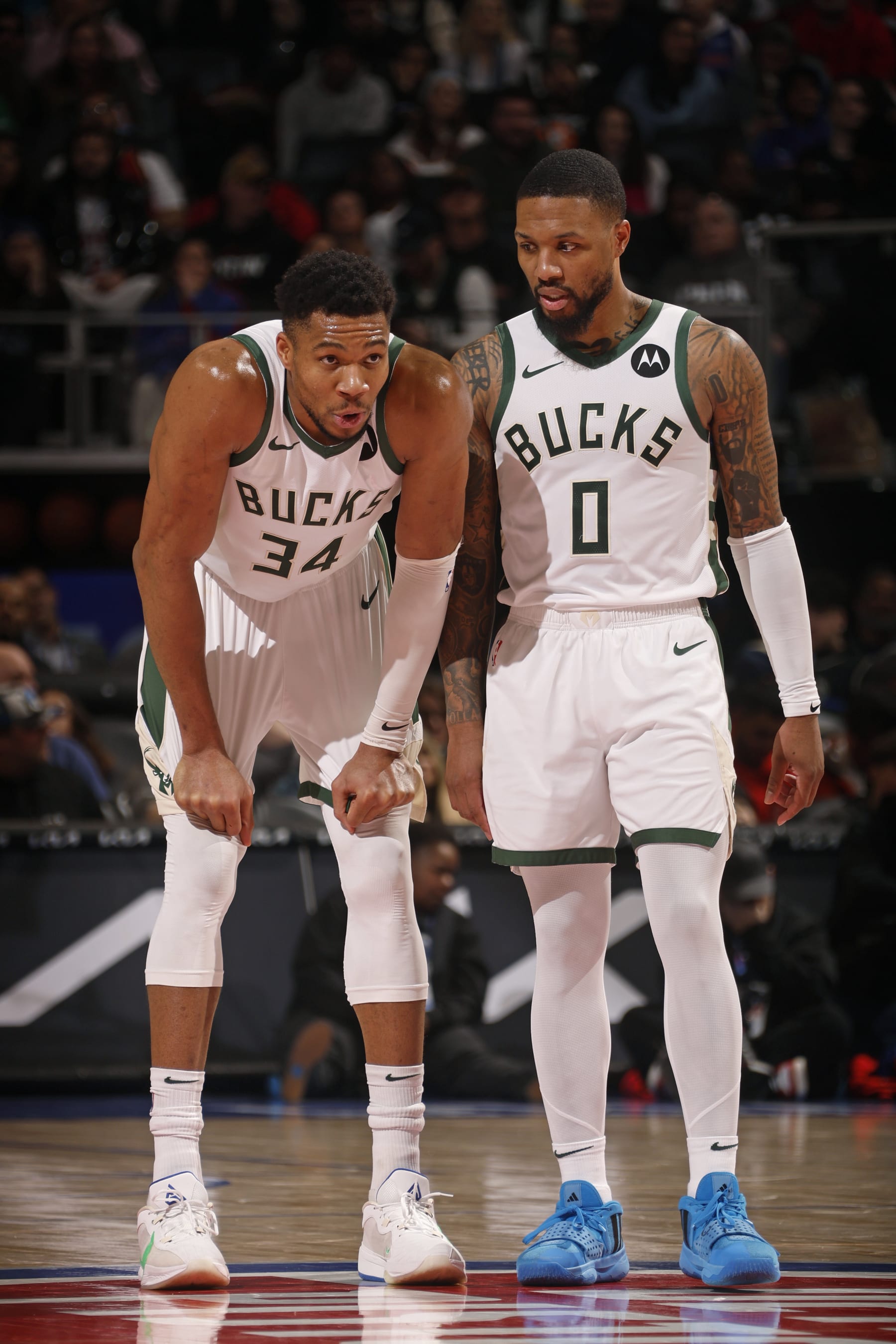 DETROIT, MI - JANUARY 20: Giannis Antetokounmpo #34 and Damian Lillard #0 of the Milwaukee Bucks talk during the game against the Detroit Pistons on January 20, 2024 at Little Caesars Arena in Detroit, Michigan. NOTE TO USER: User expressly acknowledges and agrees that, by downloading and/or using this photograph, User is consenting to the terms and conditions of the Getty Images License Agreement. Mandatory Copyright Notice: Copyright 2024 NBAE (Photo by Brian Sevald/NBAE via Getty Images)
