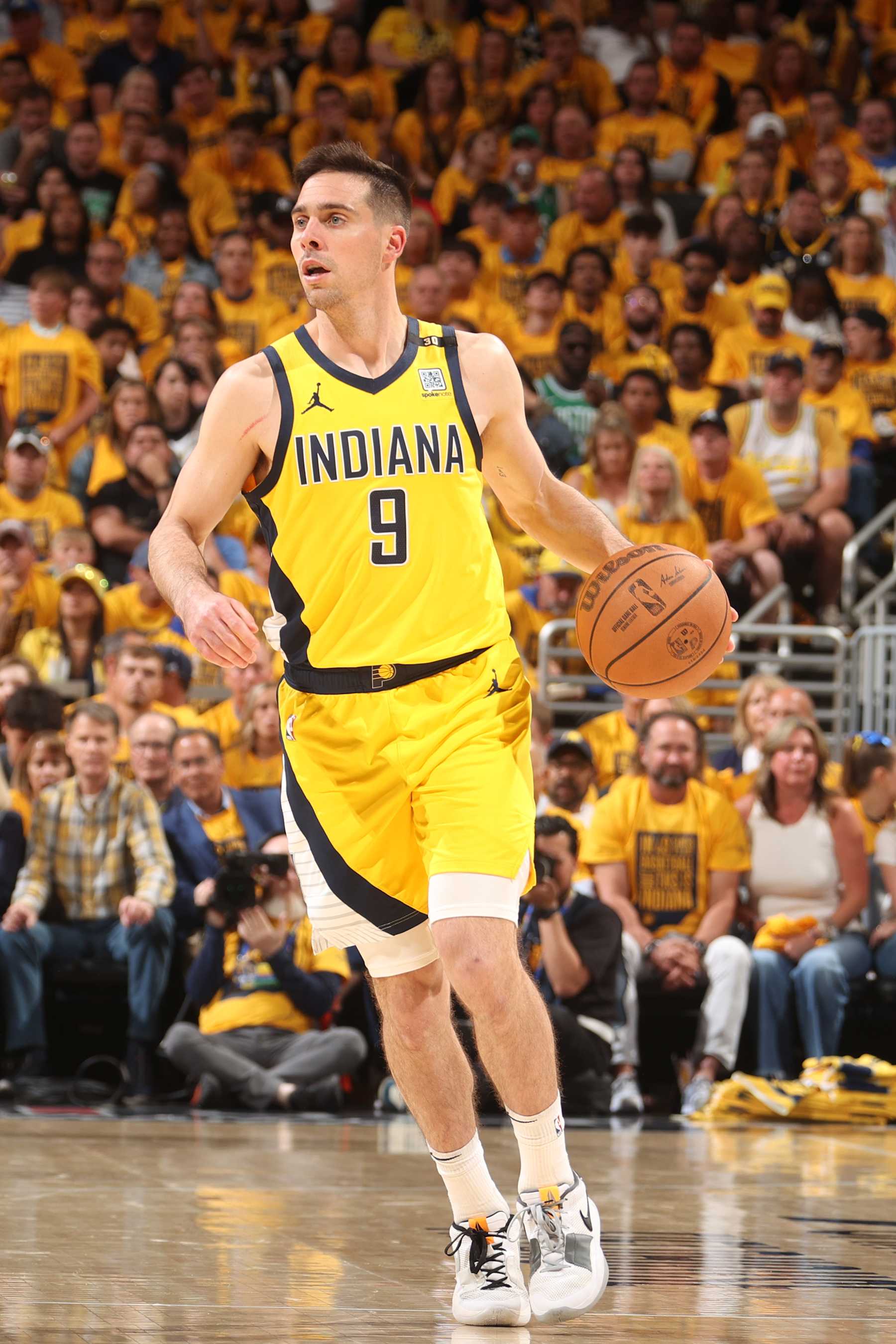 INDIANAPOLIS, IN - MAY 27: T.J. McConnell #9 of the Indiana Pacers dribbles the ball during the game against the Boston Celtics during Game 4 of the Eastern Conference Finals of the 2024 NBA Playoffs on May 27, 2024 at Gainbridge Fieldhouse in Indianapolis, Indiana. NOTE TO USER: User expressly acknowledges and agrees that, by downloading and or using this Photograph, user is consenting to the terms and conditions of the Getty Images License Agreement. Mandatory Copyright Notice: Copyright 2024 NBAE (Photo by Nathaniel S. Butler/NBAE via Getty Images)