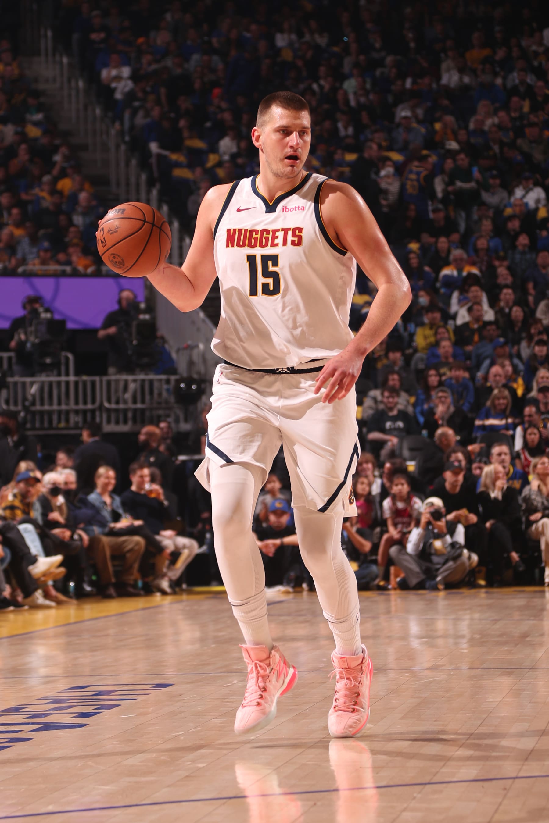 SAN FRANCISCO, CA - FEBRUARY 25: Nikola Jokic #15 of the Denver Nuggets dribbles the ball during the game against the Golden State Warriors on February 25, 2024 at Chase Center in San Francisco, California. NOTE TO USER: User expressly acknowledges and agrees that, by downloading and or using this photograph, user is consenting to the terms and conditions of Getty Images License Agreement. Mandatory Copyright Notice: Copyright 2024 NBAE (Photo by Jed Jacobsohn/NBAE via Getty Images)