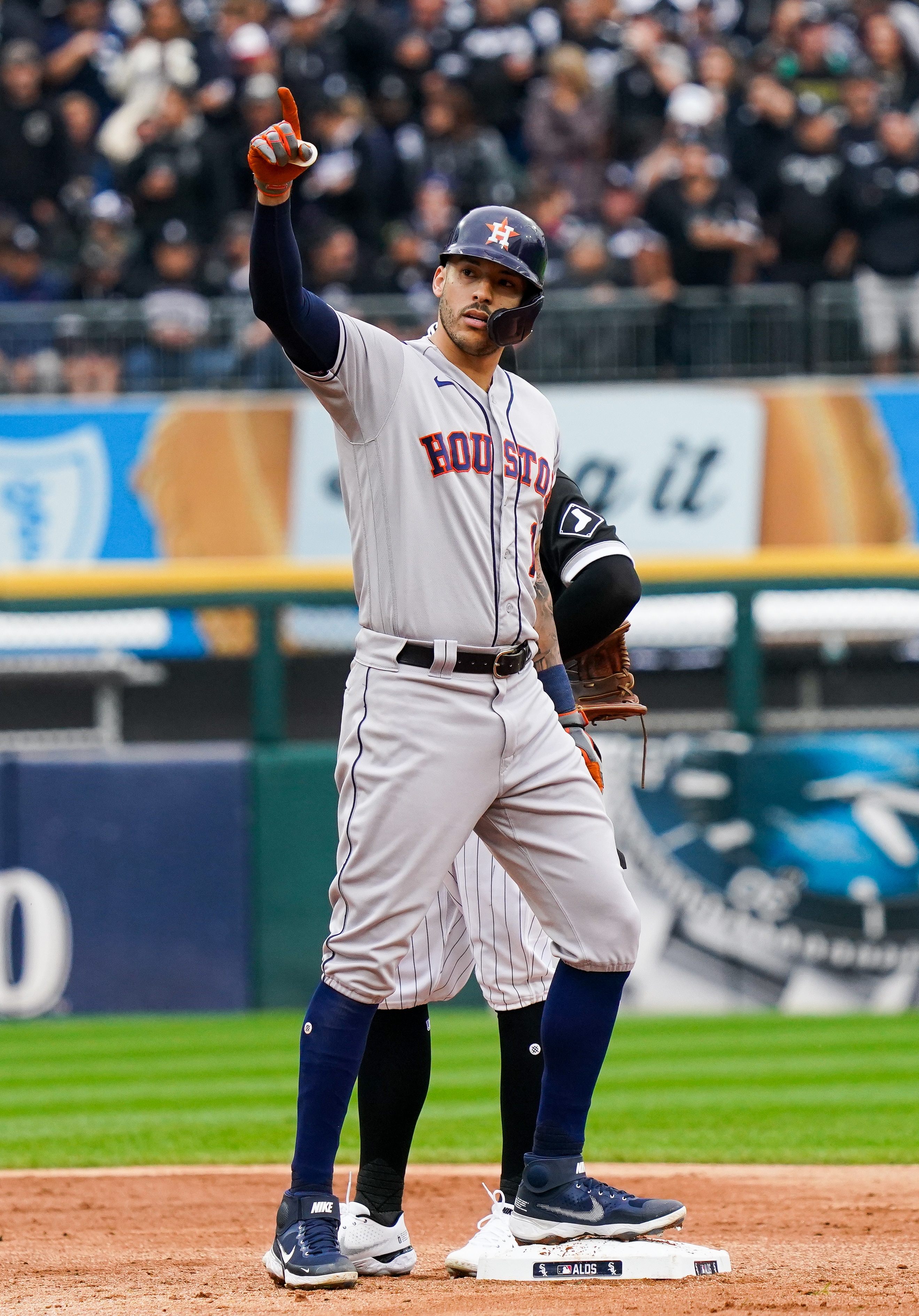 CHICAGO, IL - OCTOBER 12: Carlos Correa #1 of the Houston Astros reacts after hitting a two run double in the third inning during Game 4 of the ALDS between the Houston Astros and the Chicago White Sox at Guaranteed Rate Field on Tuesday, October 12, 2021 in Chicago, Illinois. (Photo by Nuccio DiNuzzo/MLB Photos via Getty Images)