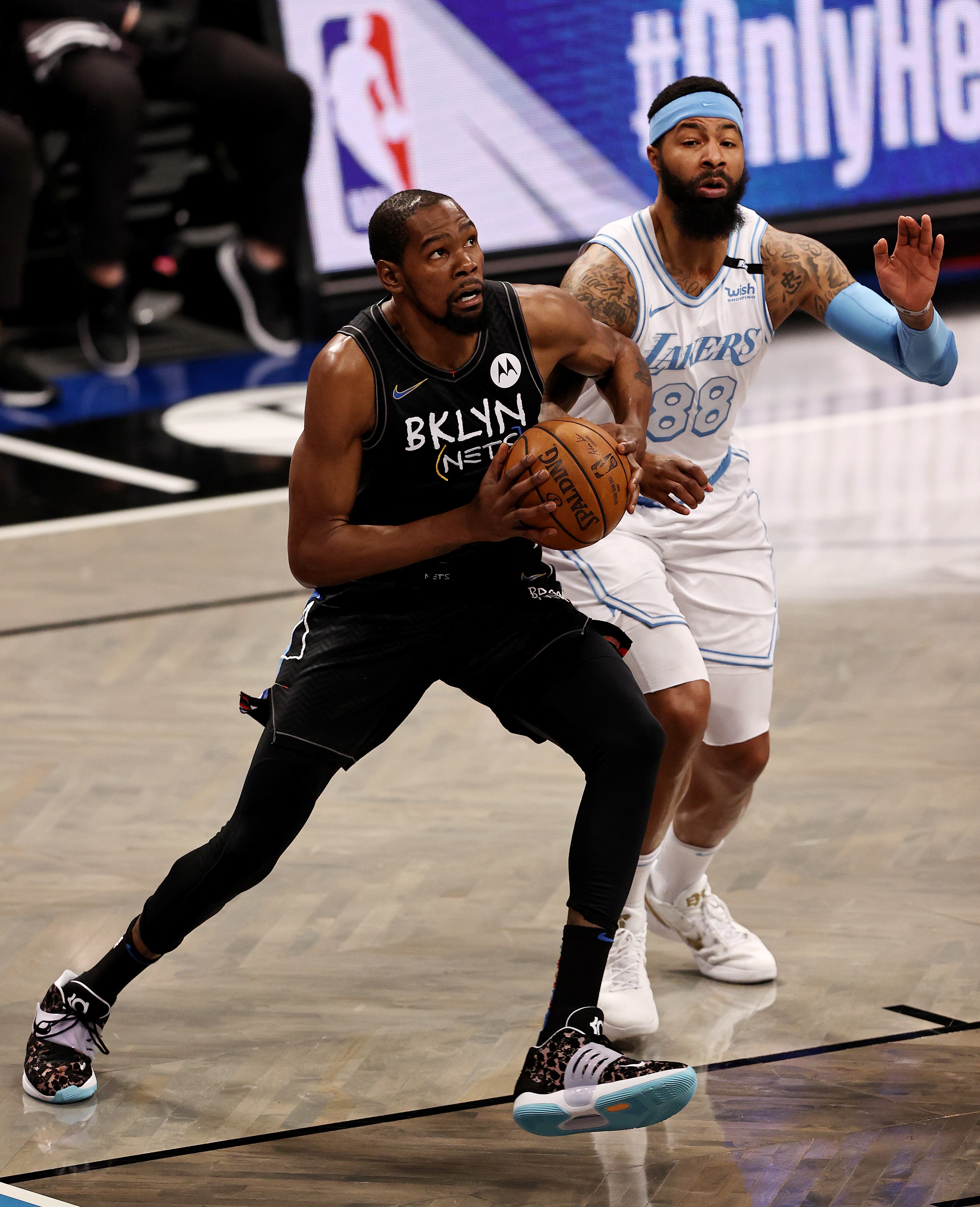 NEW YORK, NEW YORK - APRIL 10:  Kevin Durant #7 of the Brooklyn Nets heads for the net as Markieff Morris #88 of the Los Angeles Lakers defends in the first quarter at Barclays Center on April 10, 2021 in the Brooklyn borough of New York City.NOTE TO USER: User expressly acknowledges and agrees that, by downloading and or using this photograph, User is consenting to the terms and conditions of the Getty Images License Agreement. (Photo by Elsa/Getty Images)