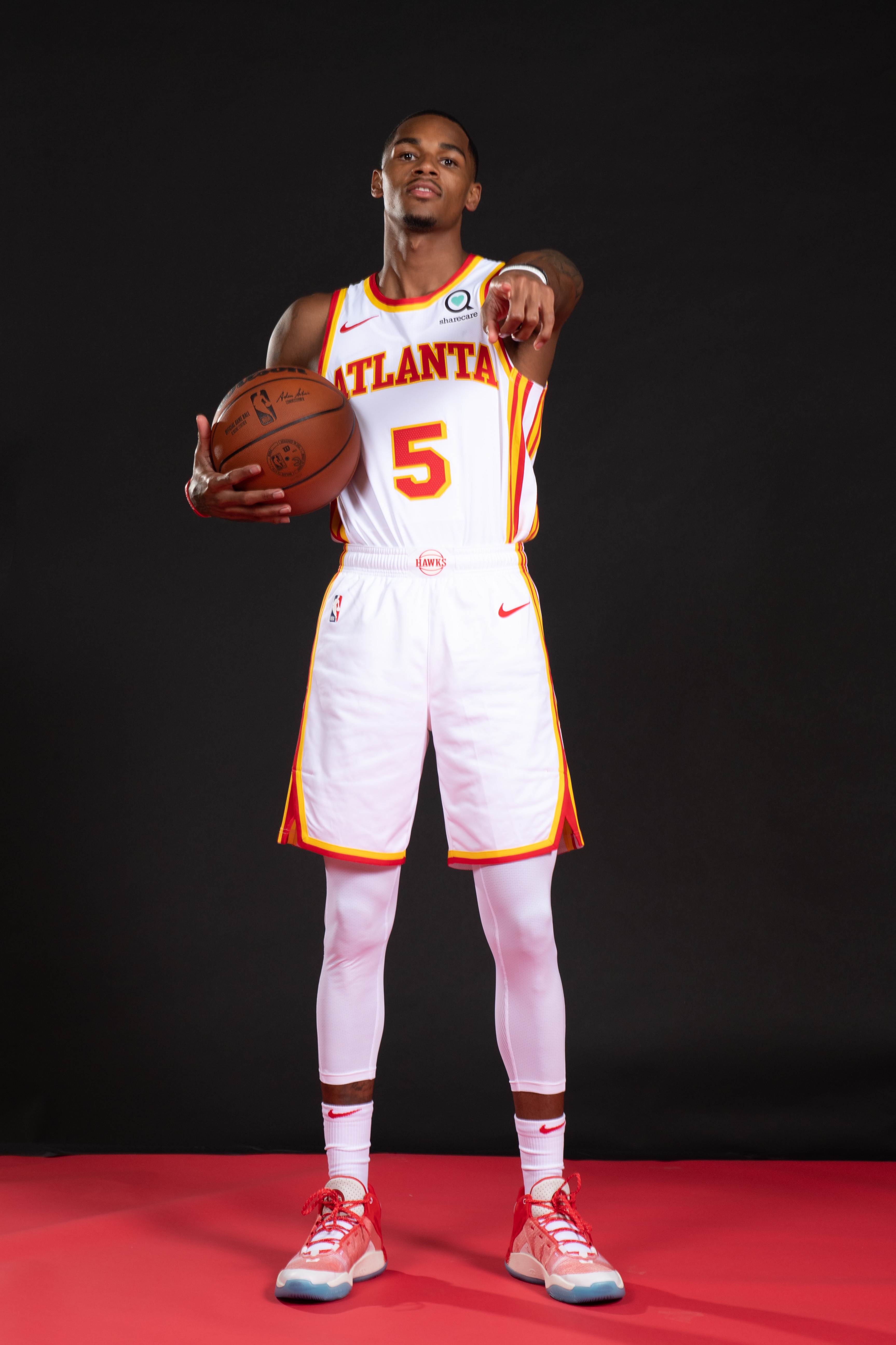 ATLANTA, GA - JULY 1: Dejounte Murray poses for a portrait after the introductory draft press conference on July 1, 2022 at State Farm Arena in Atlanta, Georgia.  NOTE TO USER: User expressly acknowledges and agrees that, by downloading and/or using this Photograph, user is consenting to the terms and conditions of the Getty Images License Agreement. Mandatory Copyright Notice: Copyright 2022 NBAE (Photo by Adam Hagy/NBAE via Getty Images)