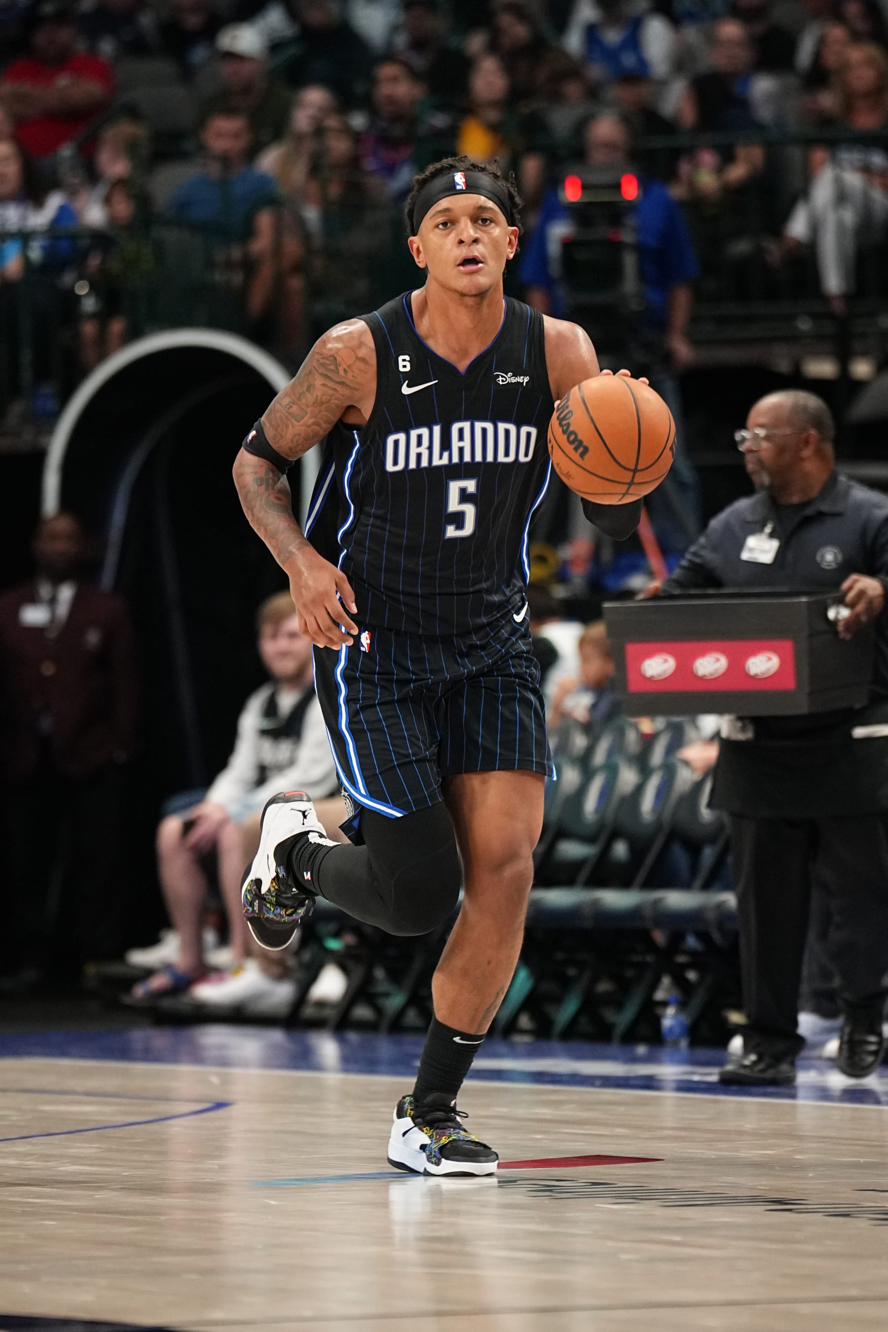 DALLAS, TX - OCTOBER 7: Paolo Banchero #5 of the Orlando Magic dribbles the ball against the Dallas Mavericks during a preseason game on October 7, 2022 at the American Airlines Center in Dallas, Texas. NOTE TO USER: User expressly acknowledges and agrees that, by downloading and or using this photograph, User is consenting to the terms and conditions of the Getty Images License Agreement. Mandatory Copyright Notice: Copyright 2022 NBAE (Photo by Glenn James/NBAE via Getty Images)